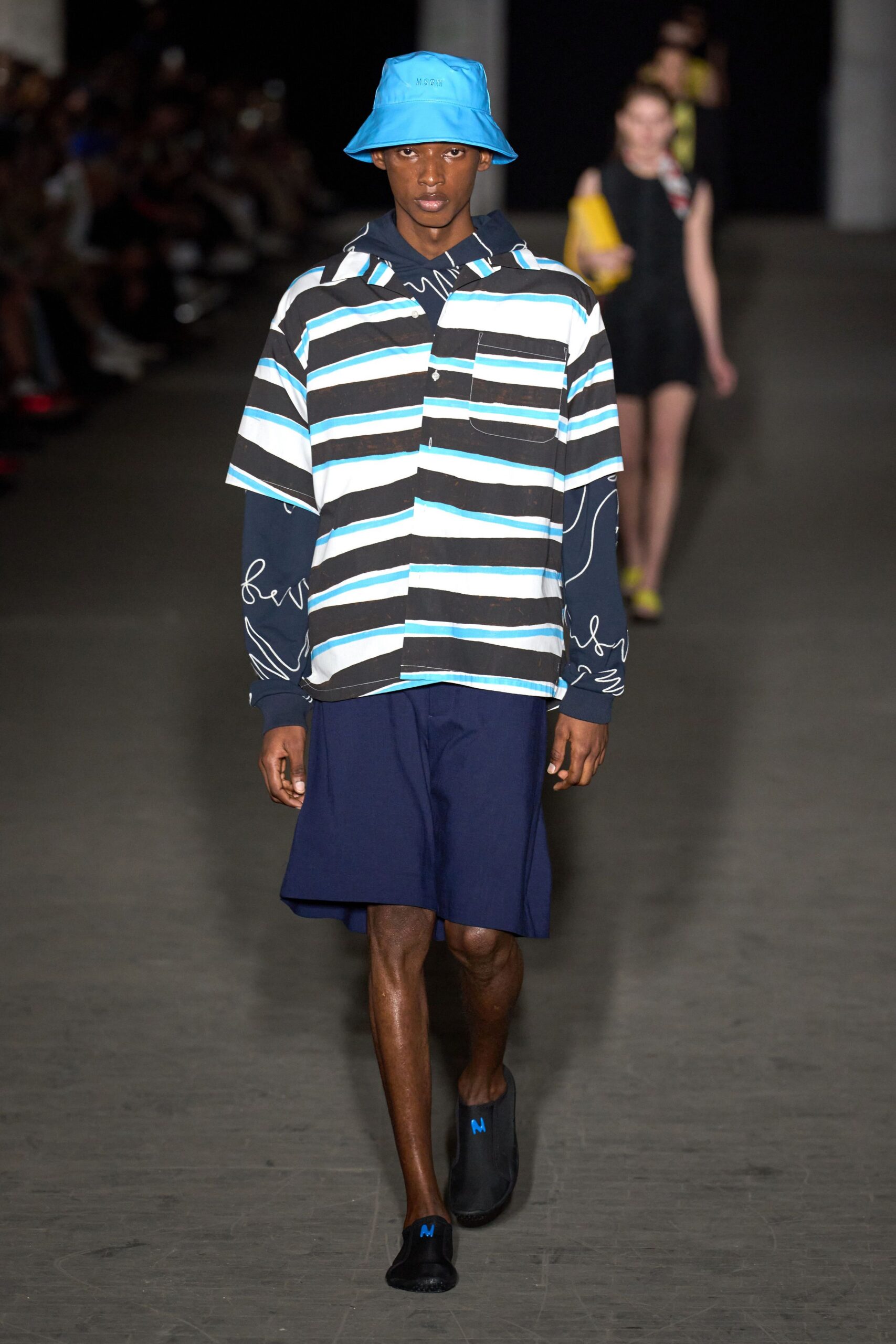 striped shirt and navy shorts