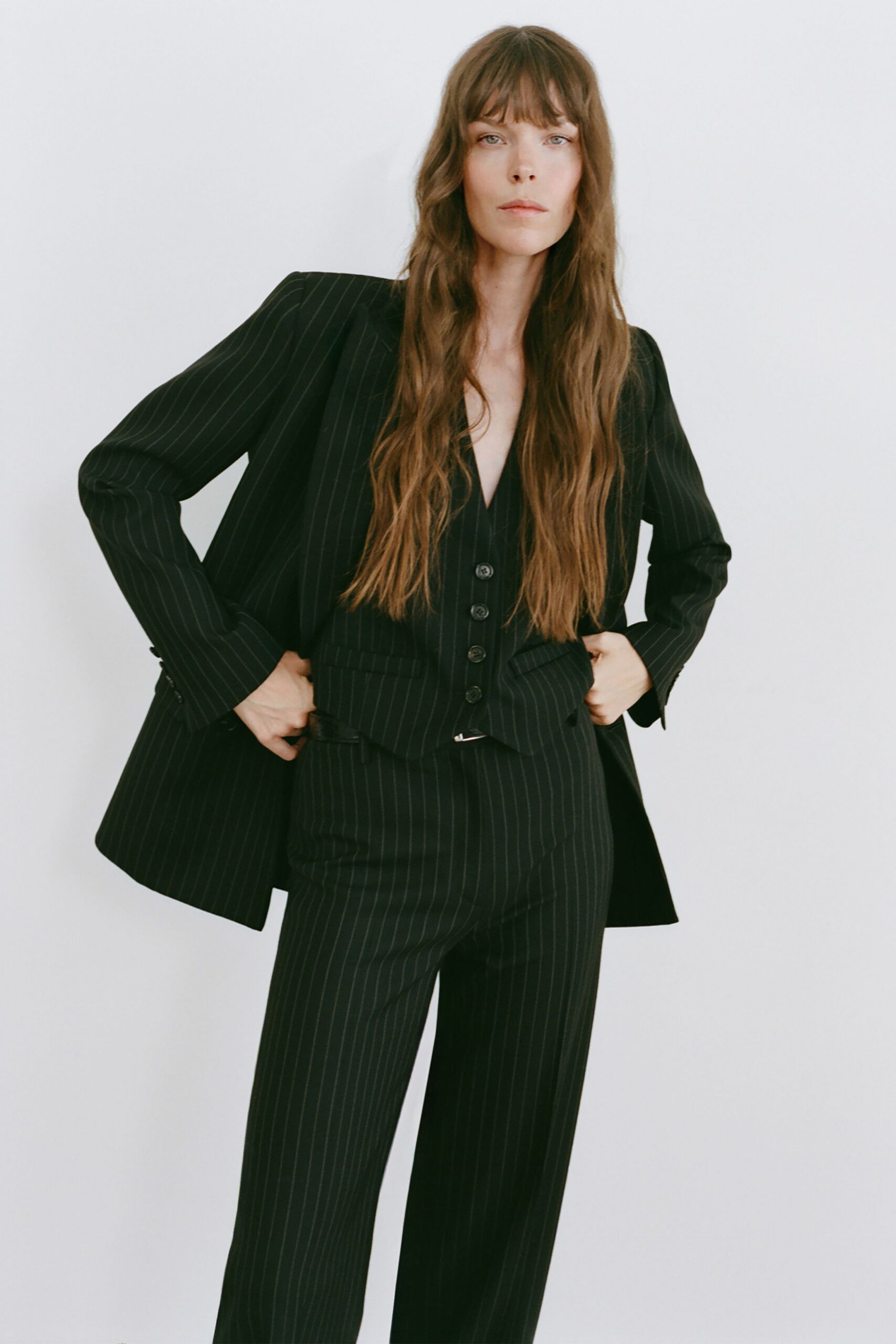 black sleeveless v-neck fitted striped buttoned vest