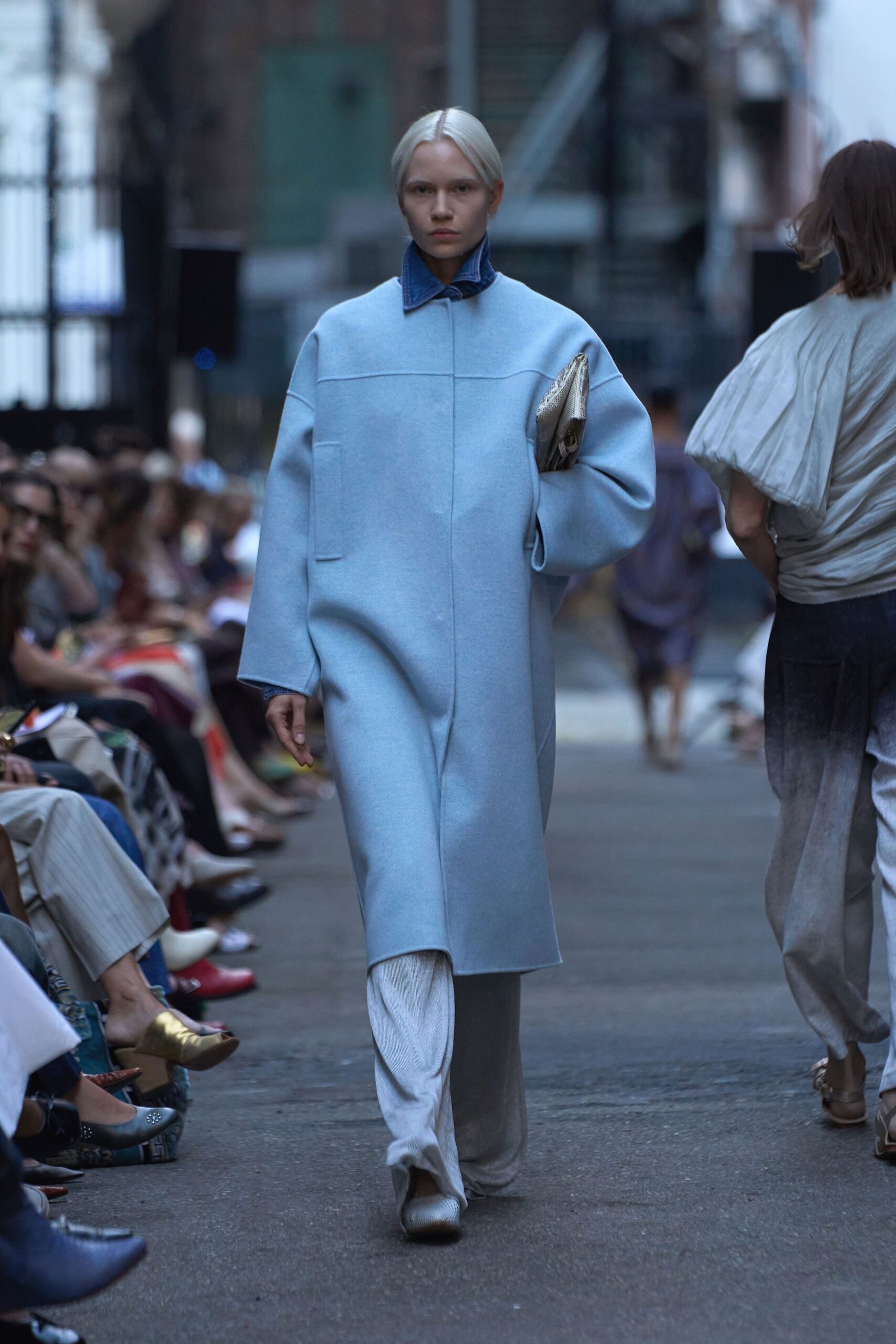 blue wool coat with white pants