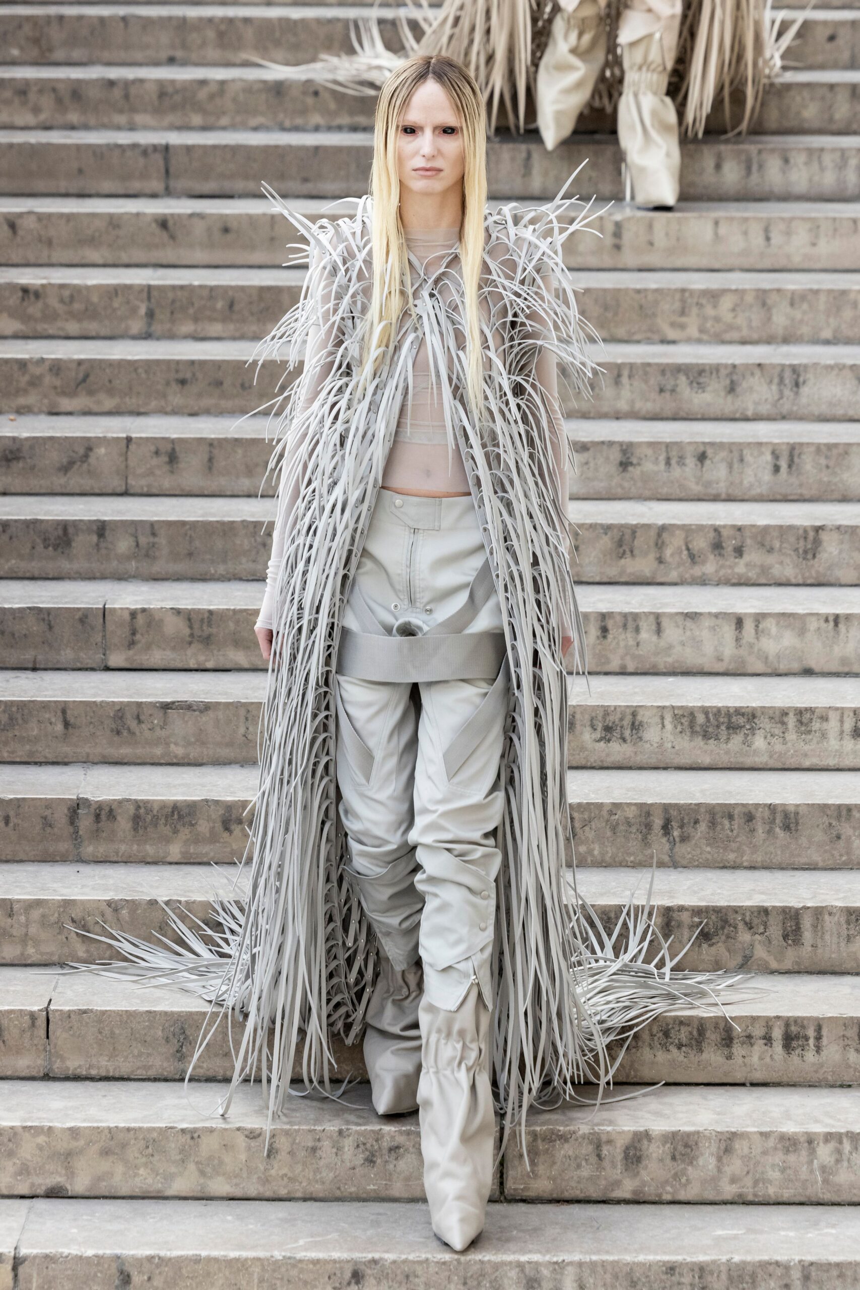beige fringed coat with fitted top