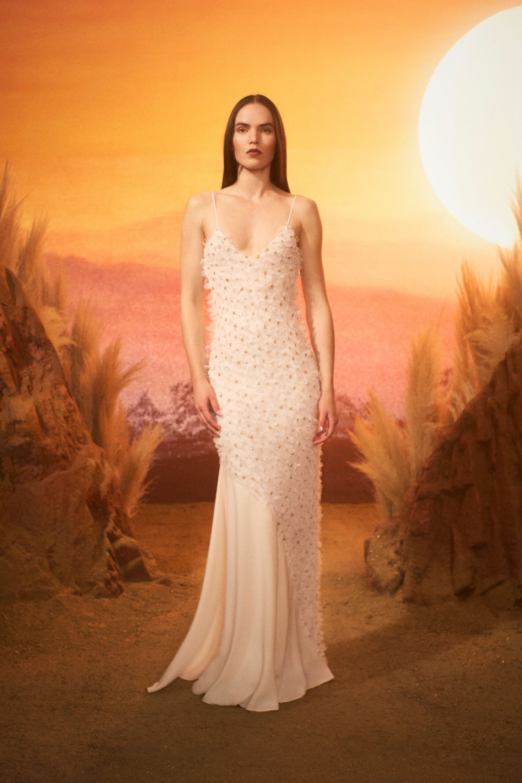 white beaded sleeveless gown