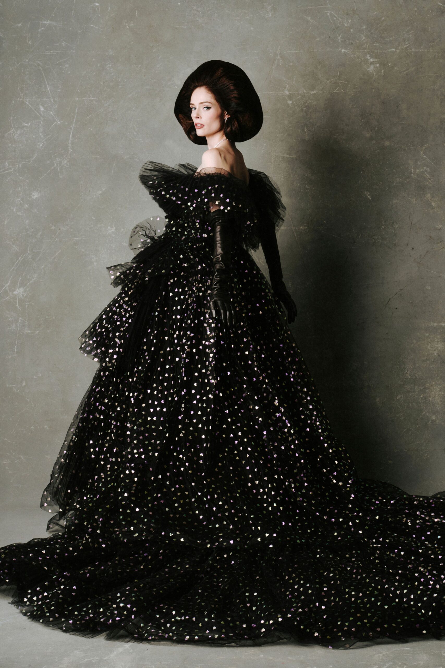 black off-shoulder gown with hat