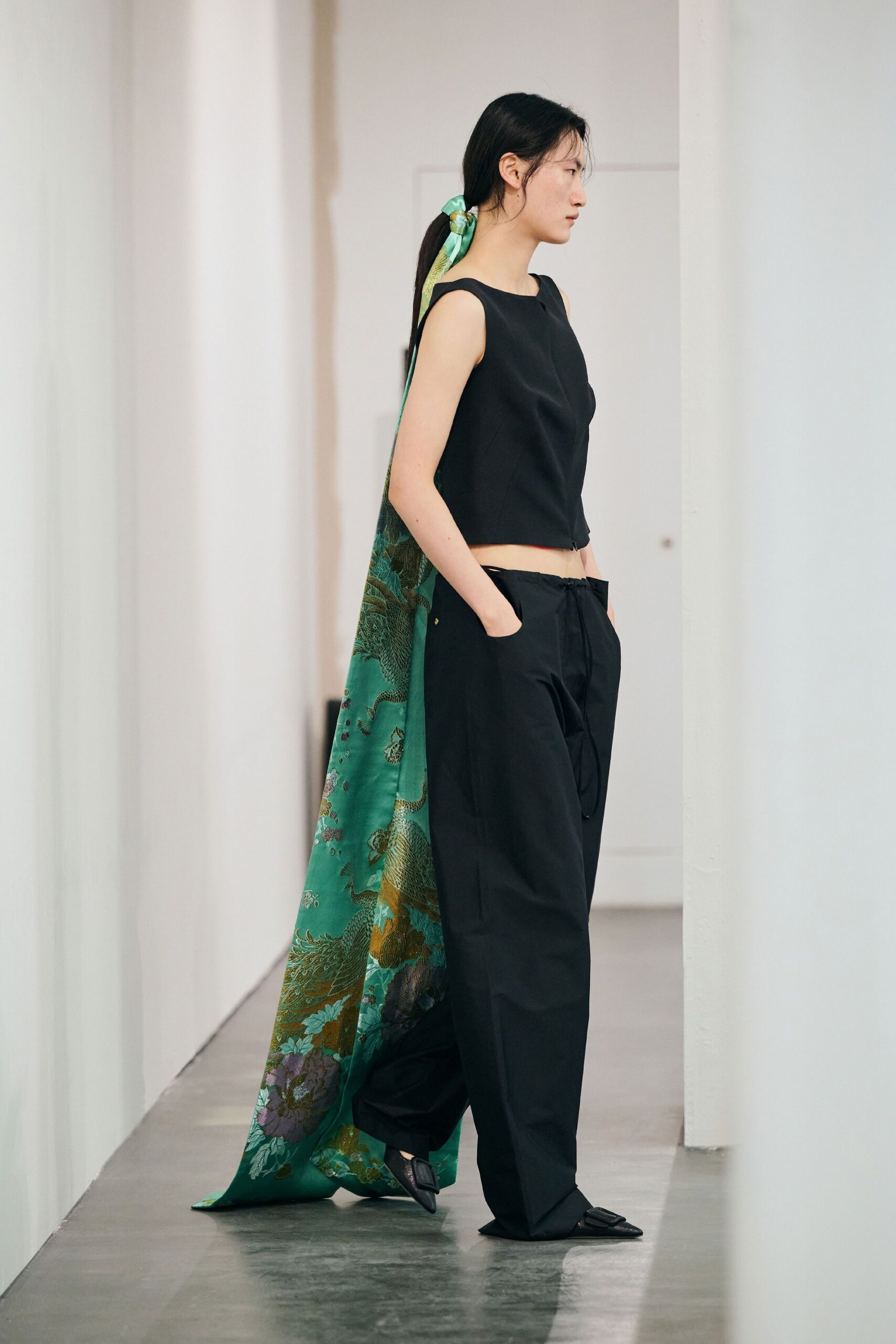 black fitted top and relaxed pants