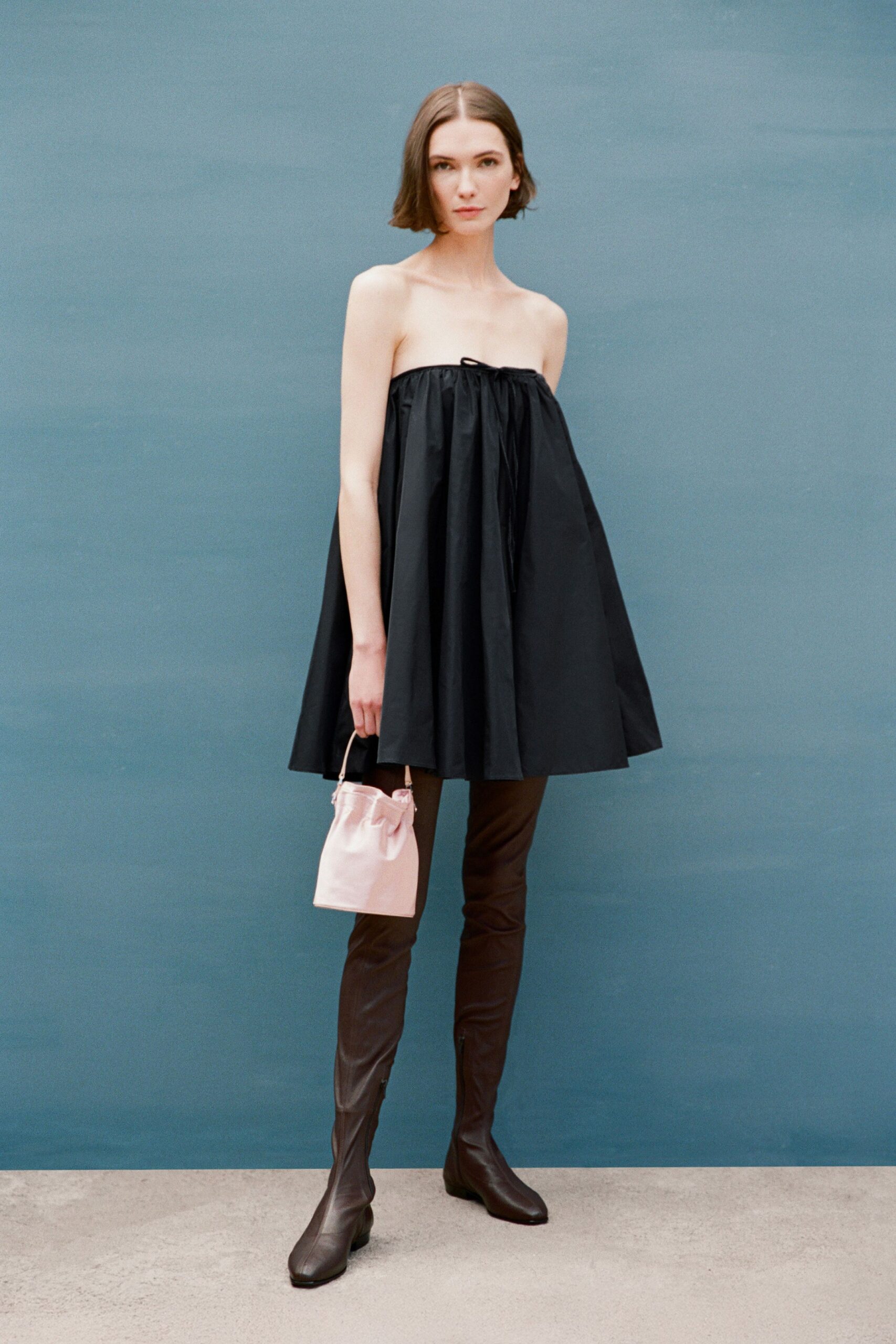 black strapless mini dress with boots