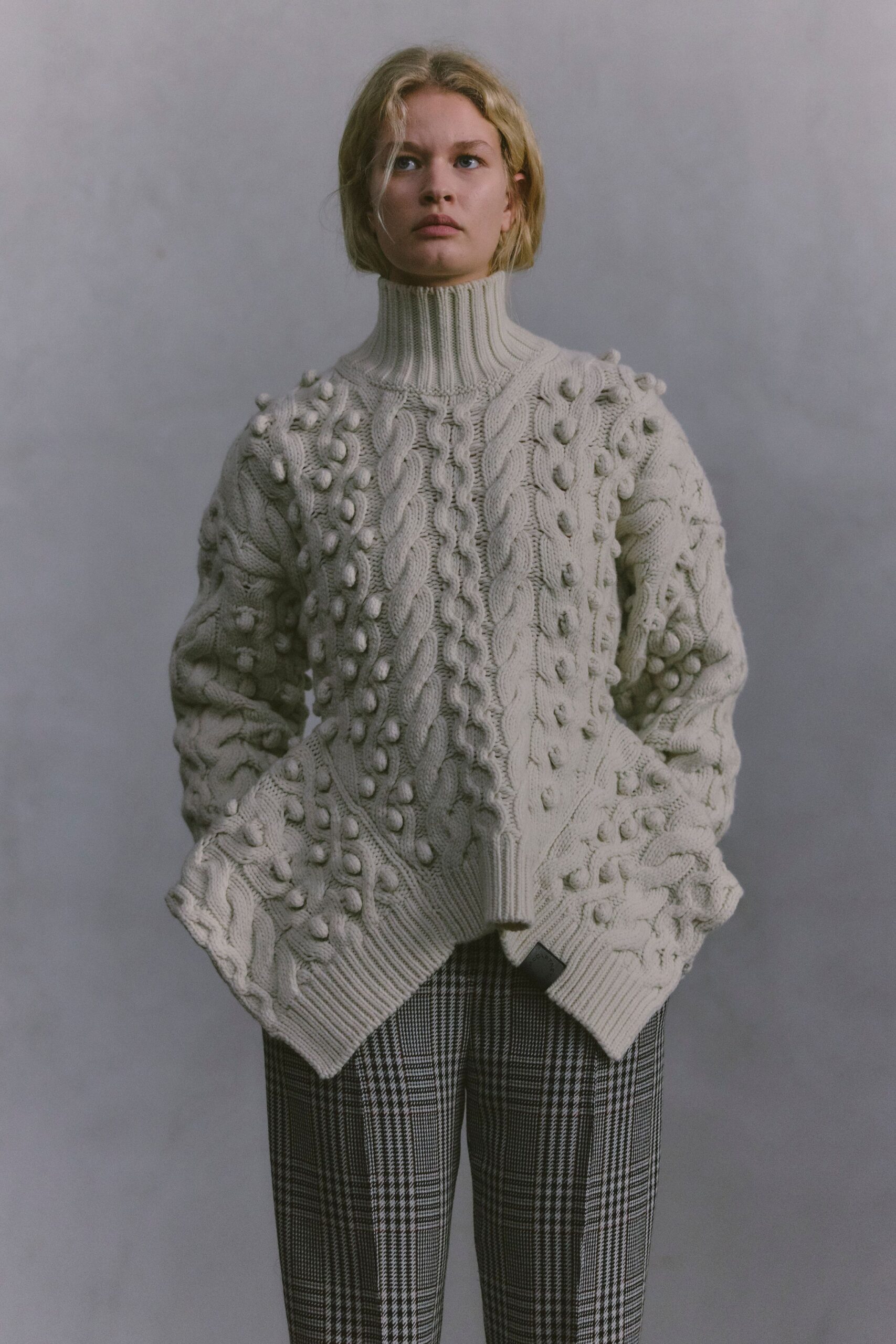 white wool long-sleeve turtleneck relaxed textured sweater