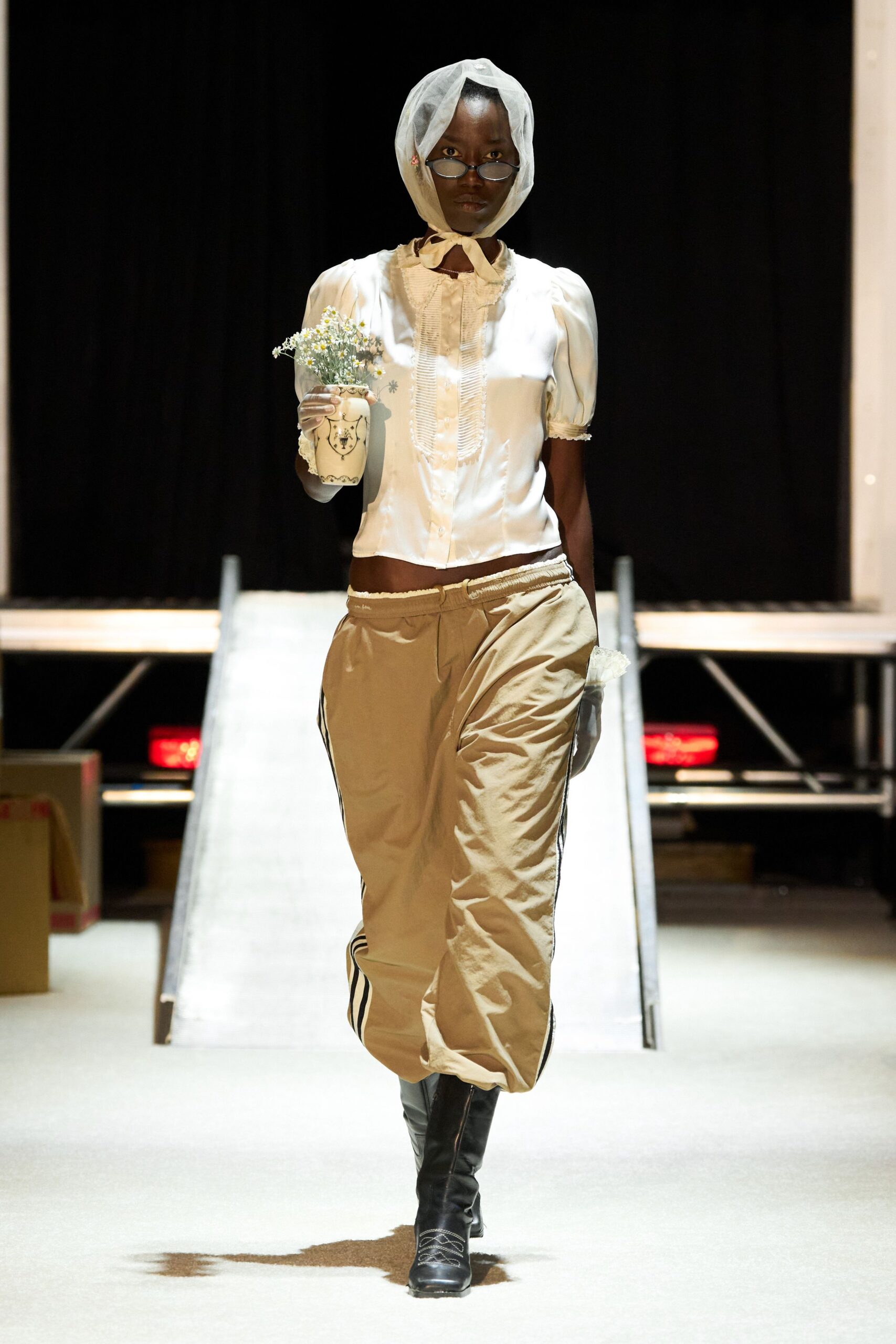 white silk ruffled top with beige cargo pants