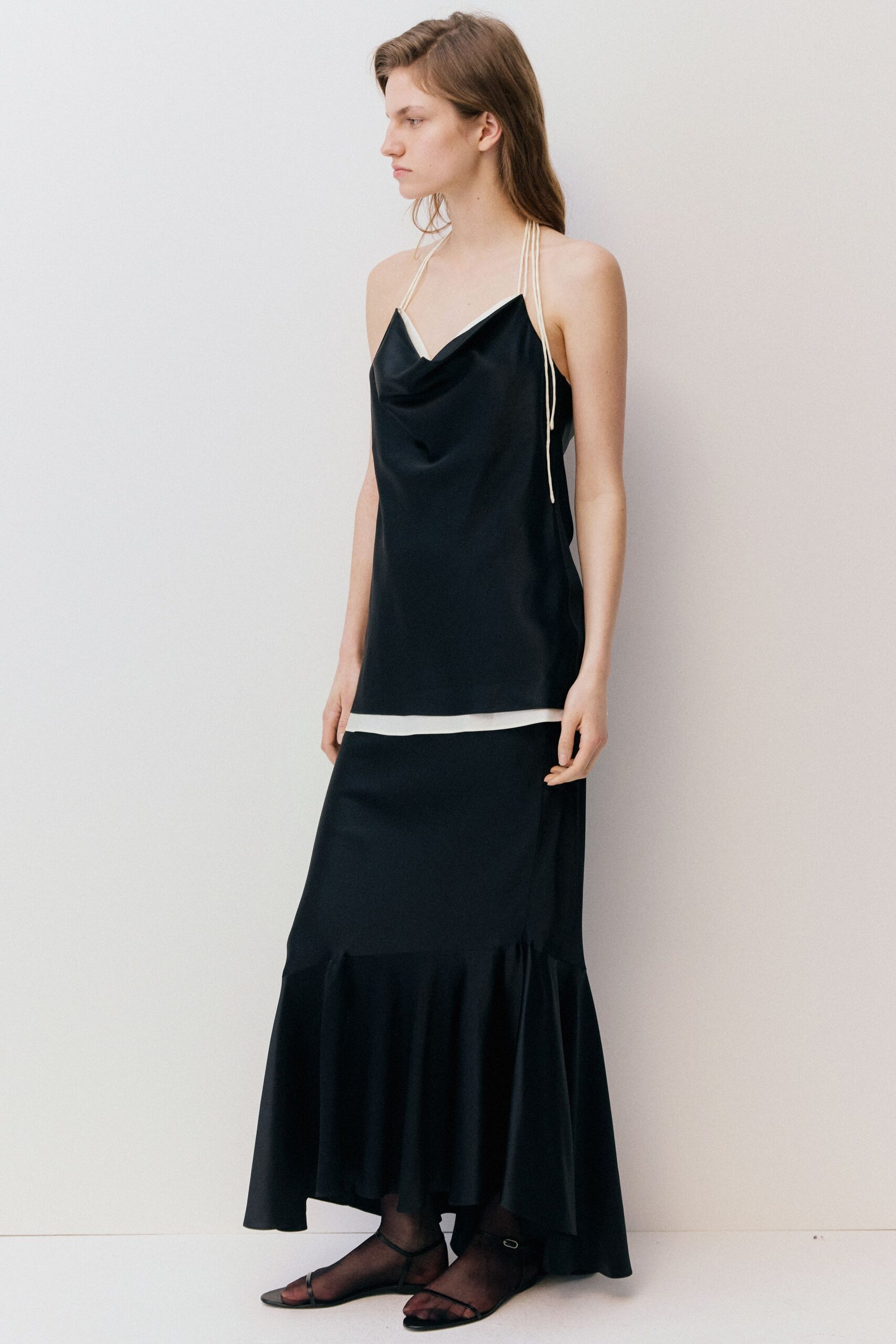 black silk sleeveless v-neck fitted draped tiered gown