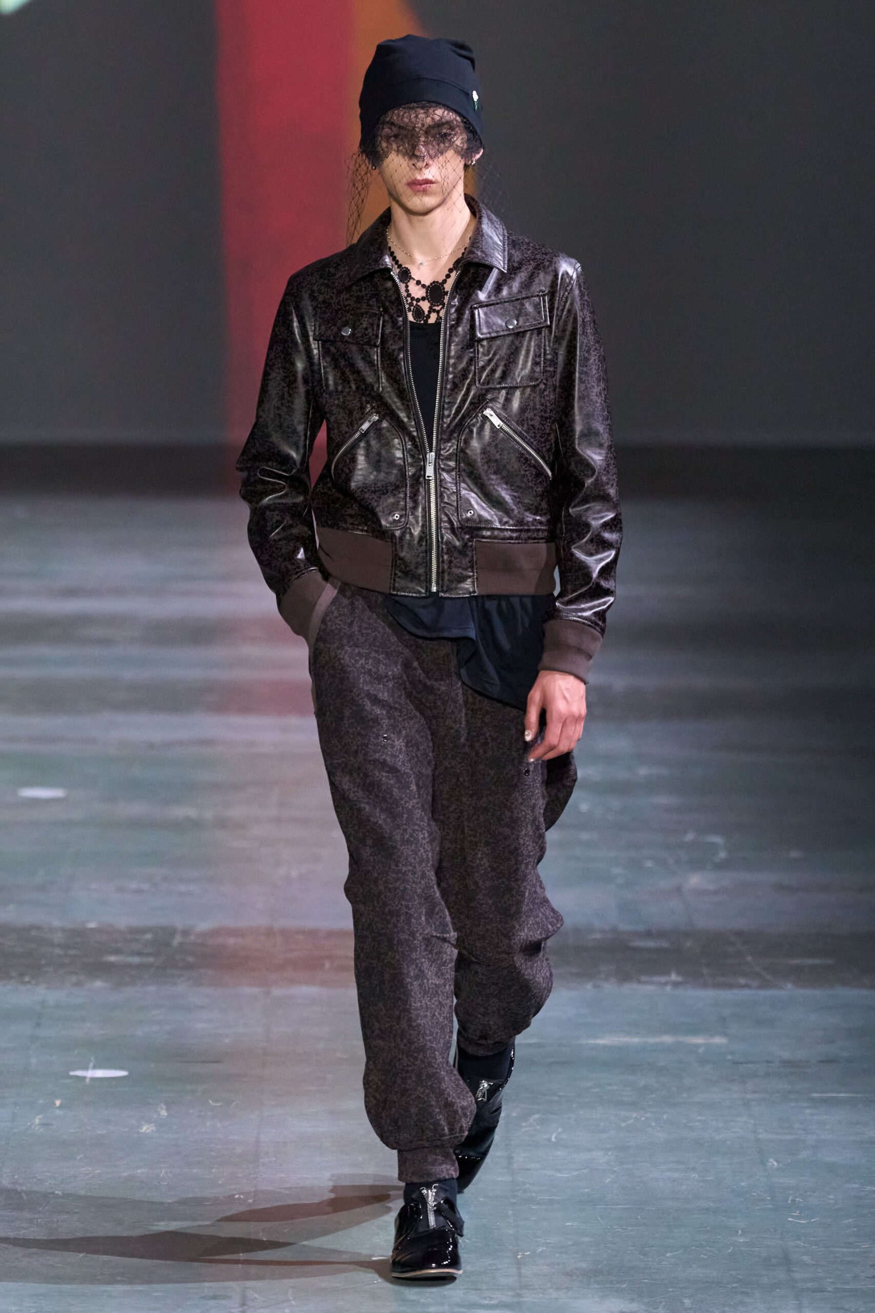 black leather long-sleeve collared fitted zippered shiny jacket