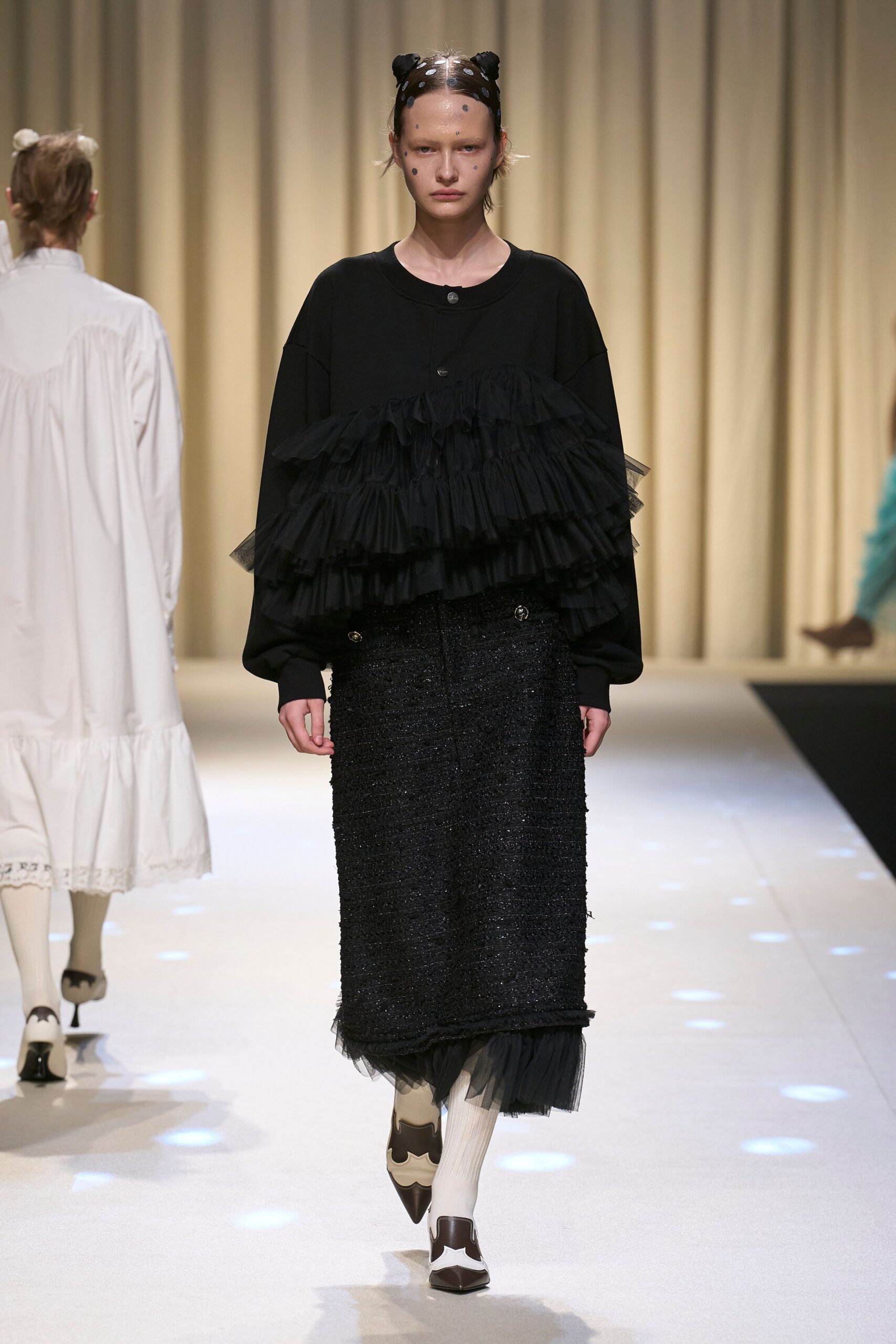 black ruffled top and pencil skirt