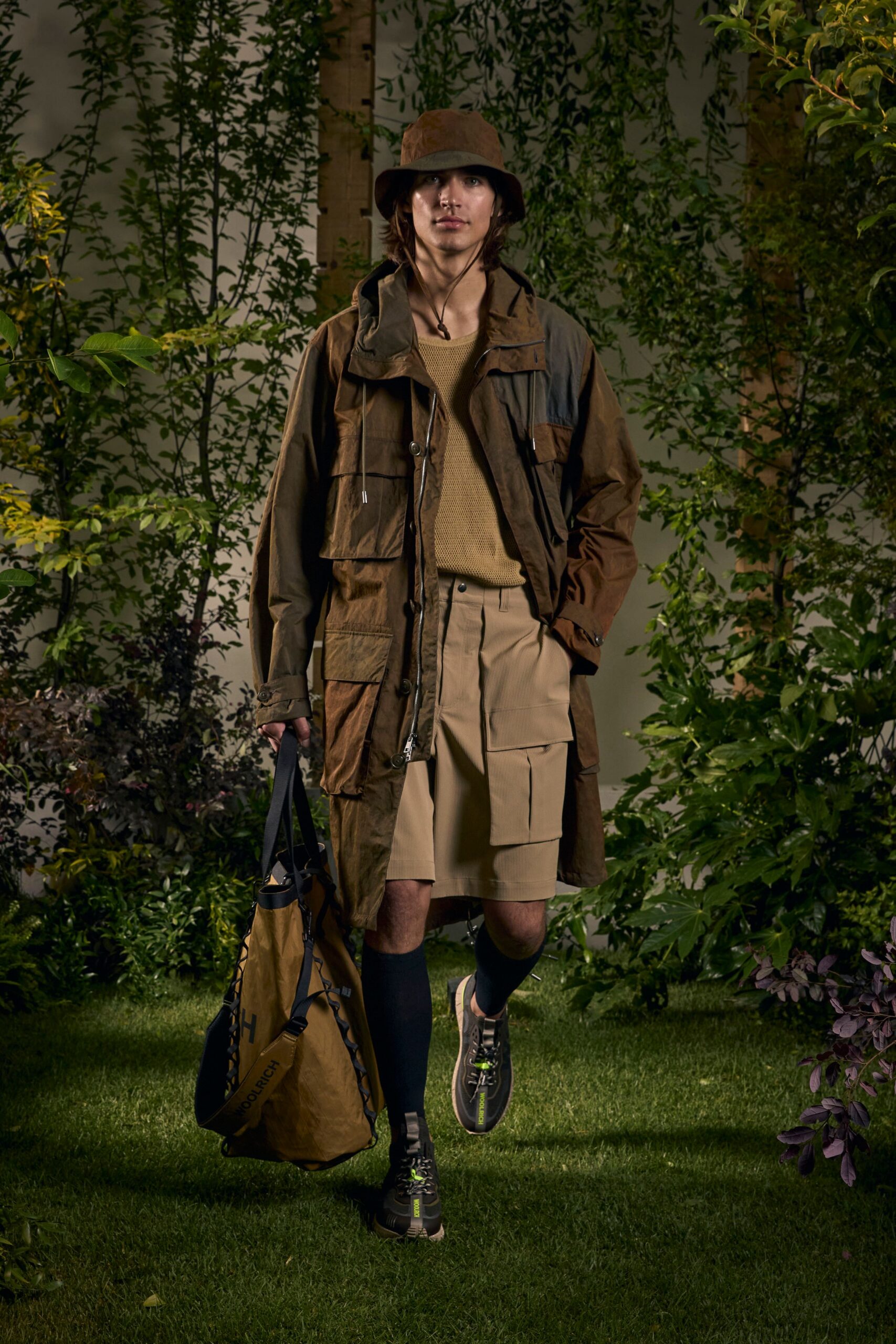 brown relaxed coat with beige shorts