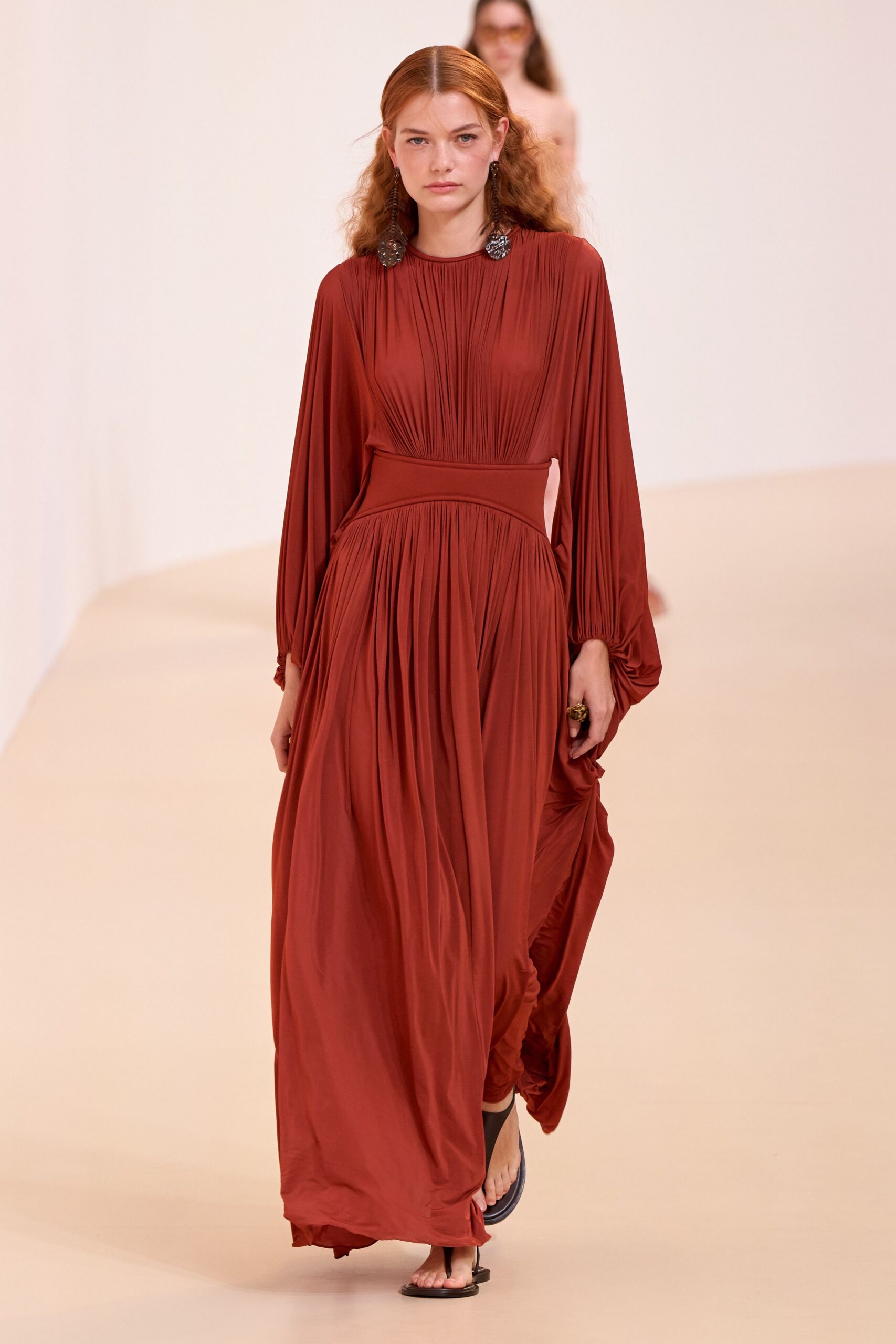 red silk long-sleeve gown