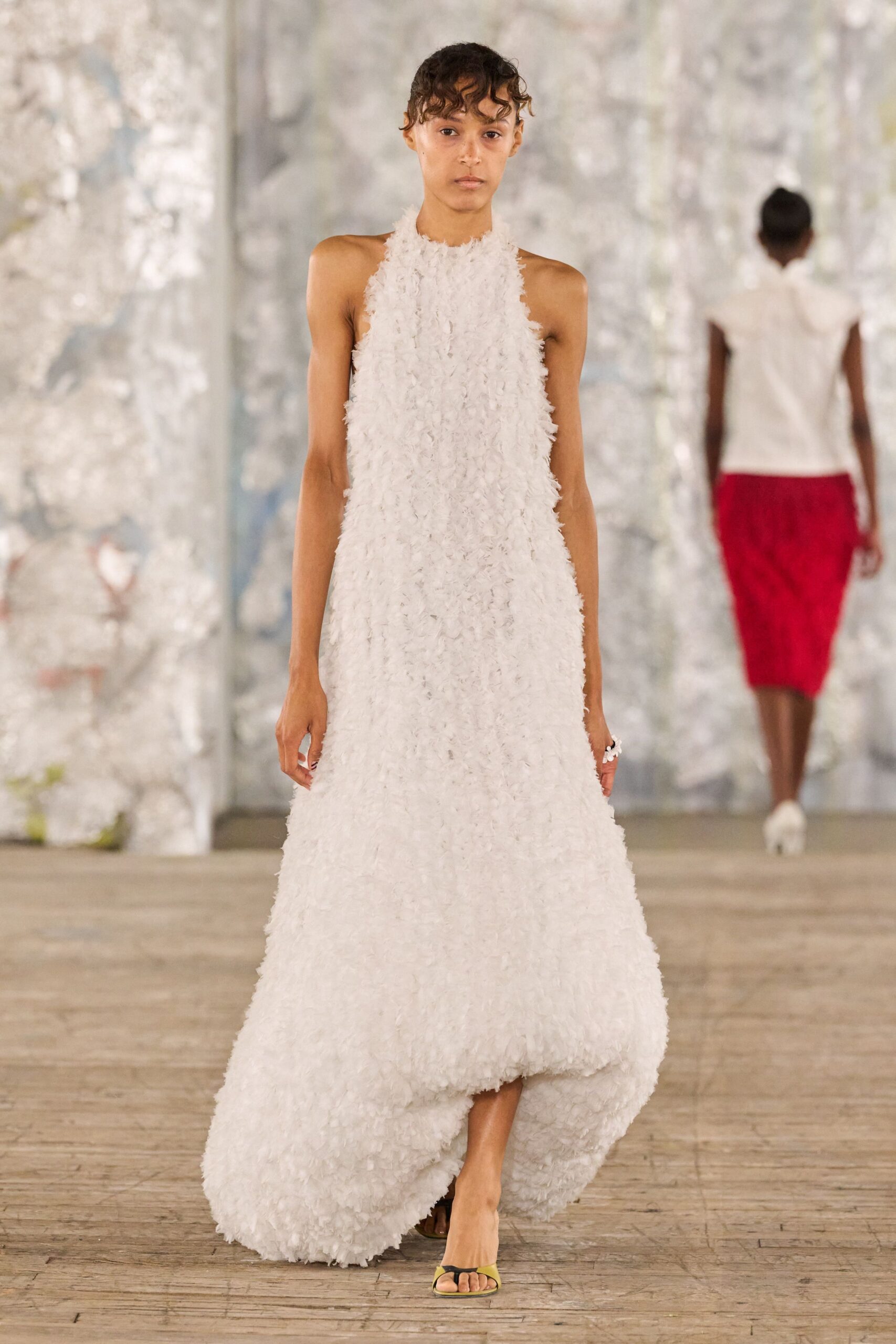 white ruffled gown with red skirt