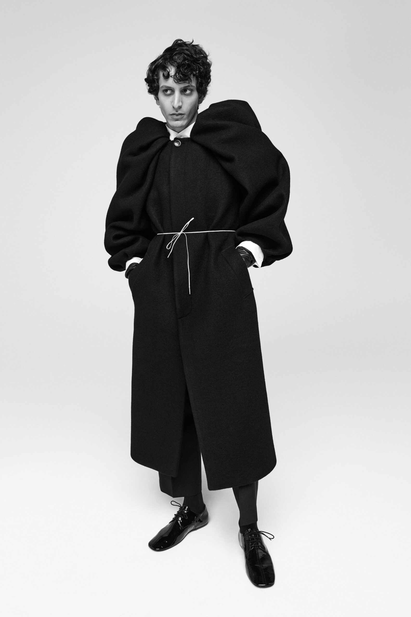 black wool long-sleeve collared relaxed draped belted coat