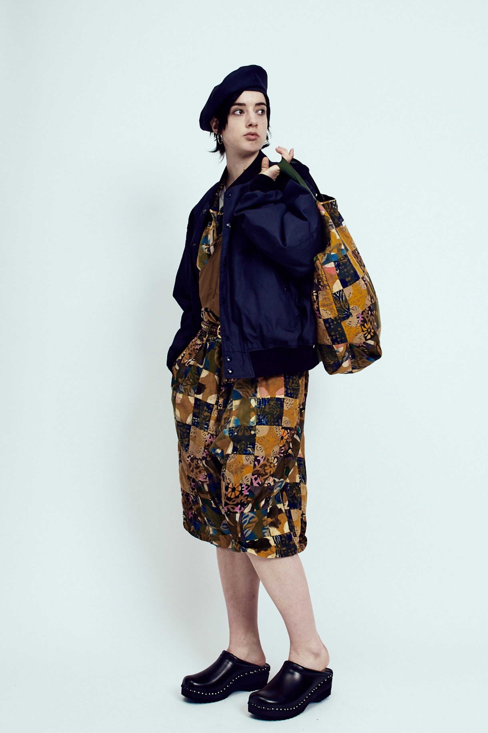 black jacket brown top multi skirt