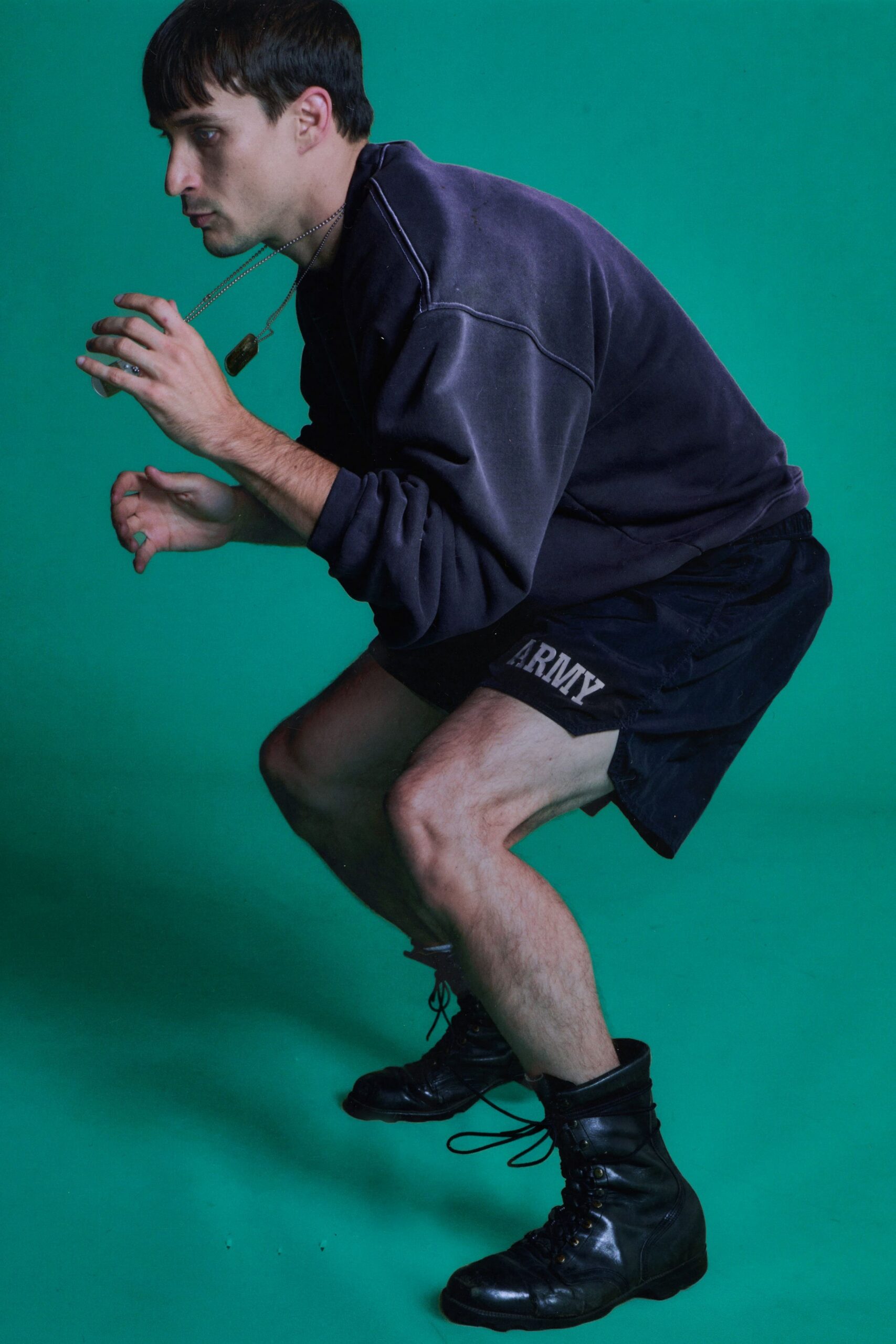 black hoodie and shorts with boots