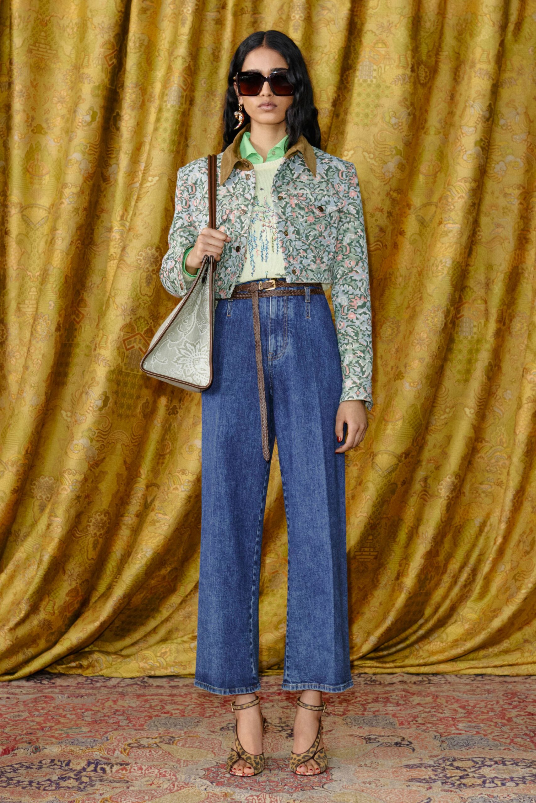 embroidered green jacket with denim pants