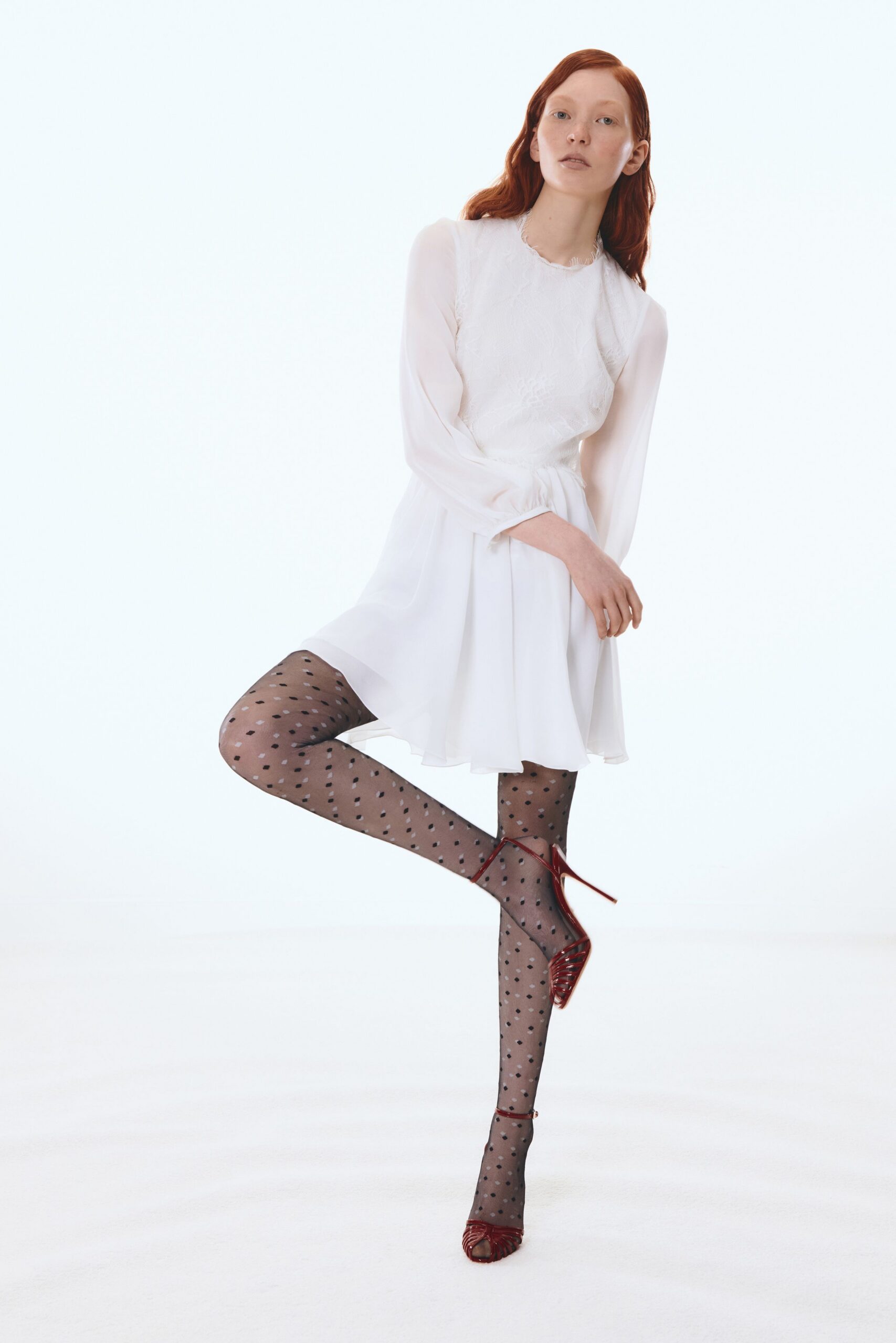 white mini dress with red shoes