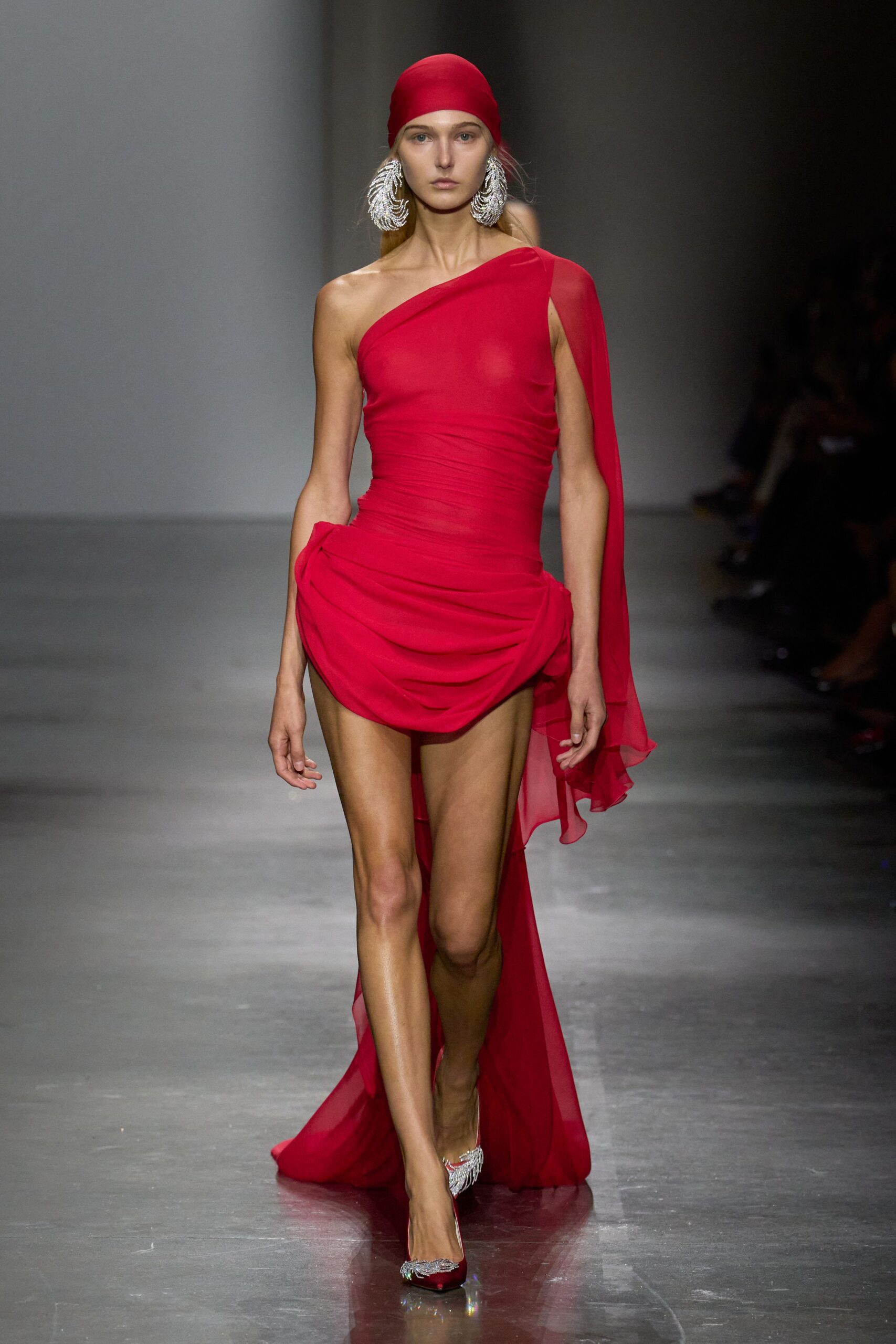red silk sleeveless asymmetric fitted draped flowing gown