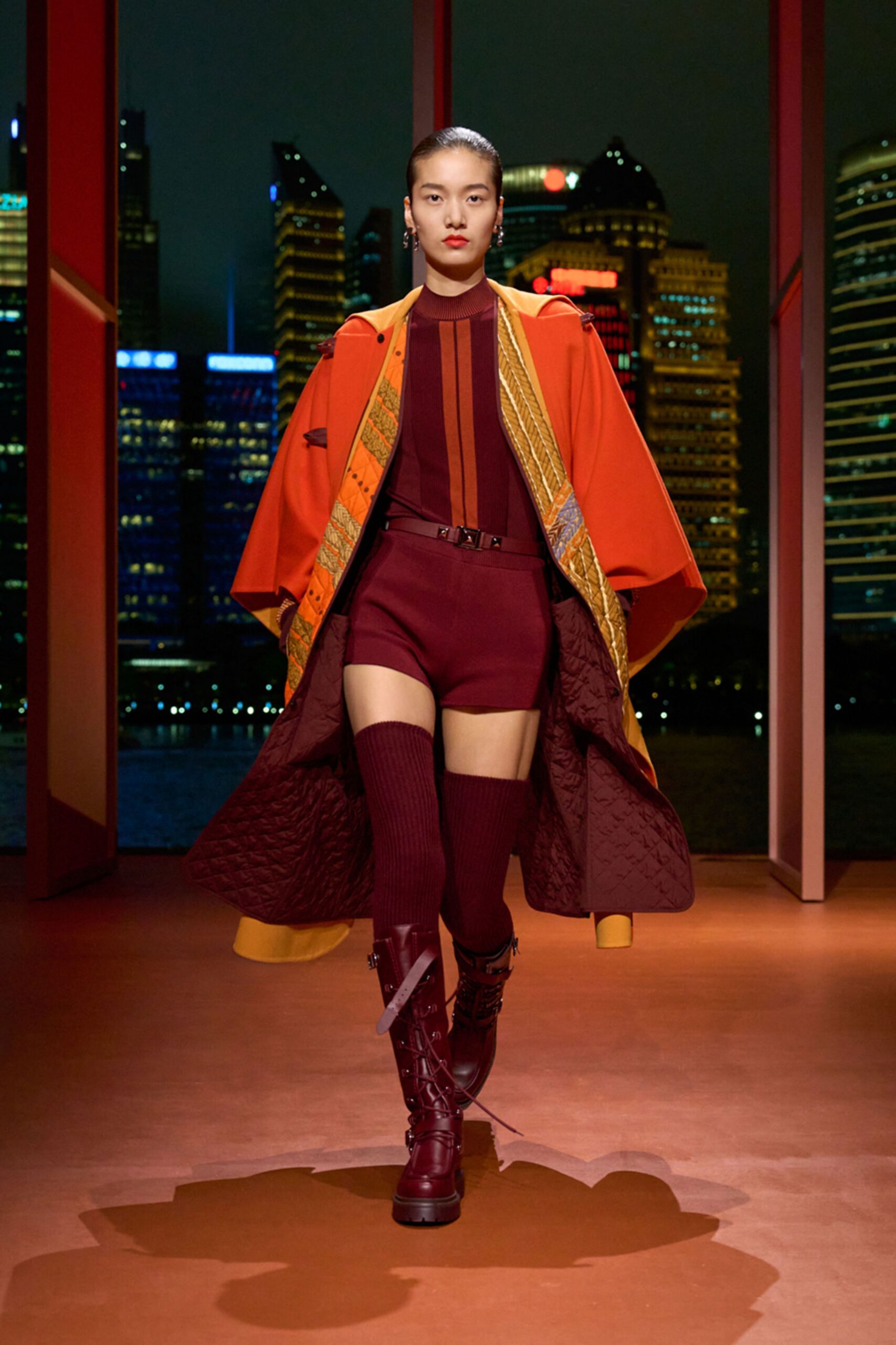orange coat maroon jumpsuit