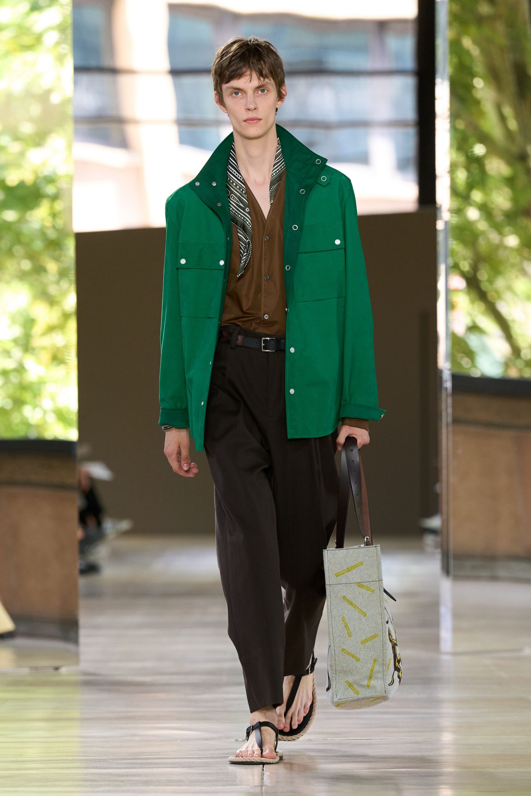 green jacket brown shirt black pants