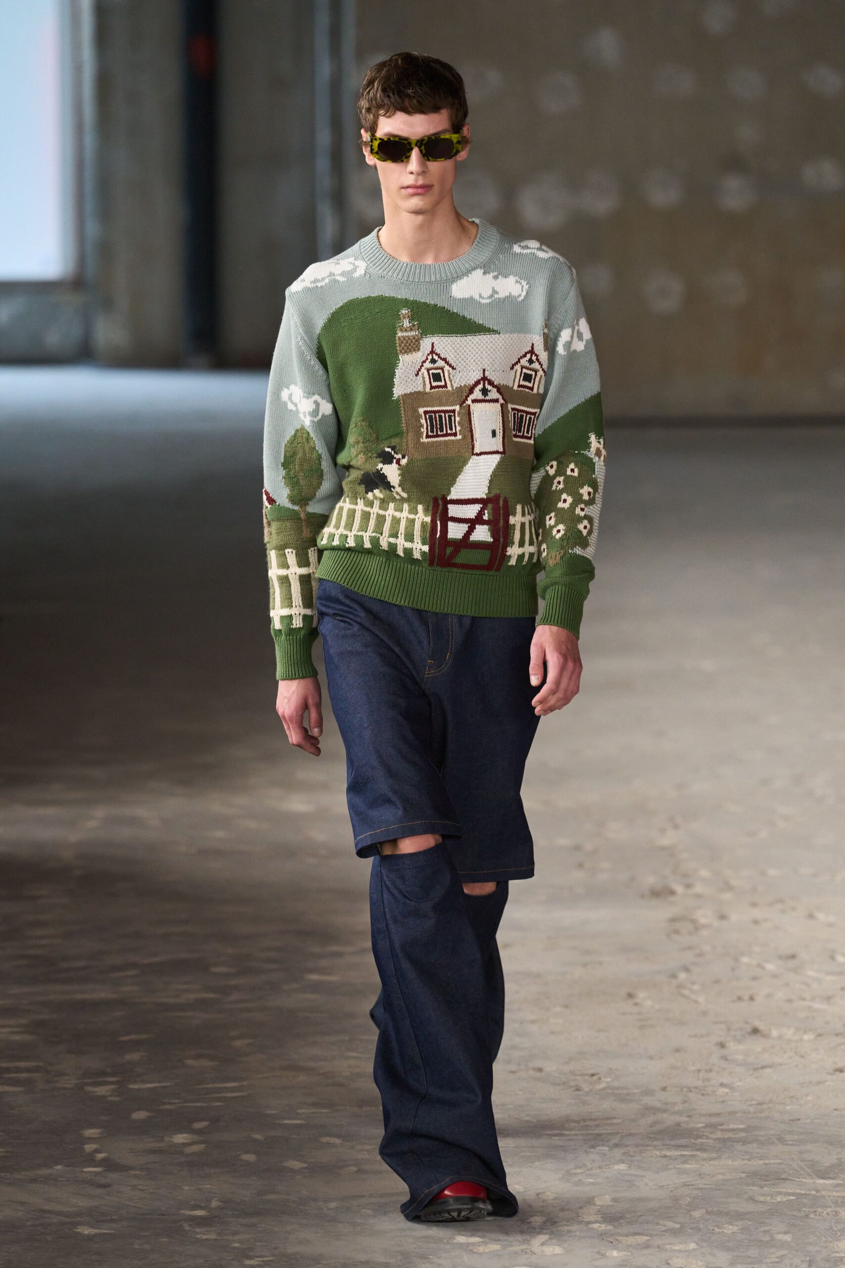 green embroidered sweater with distressed jeans