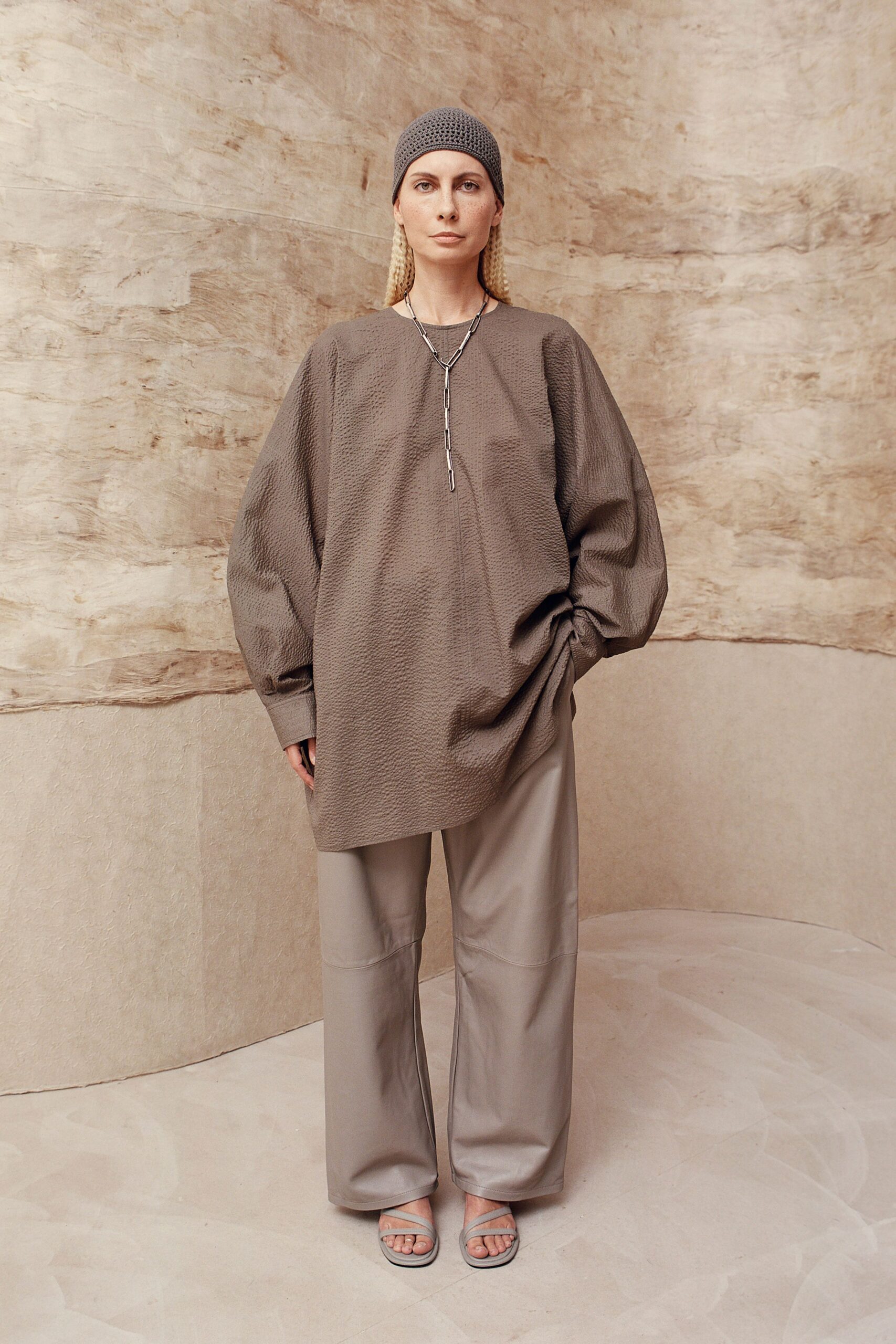 gray relaxed top with beige pants
