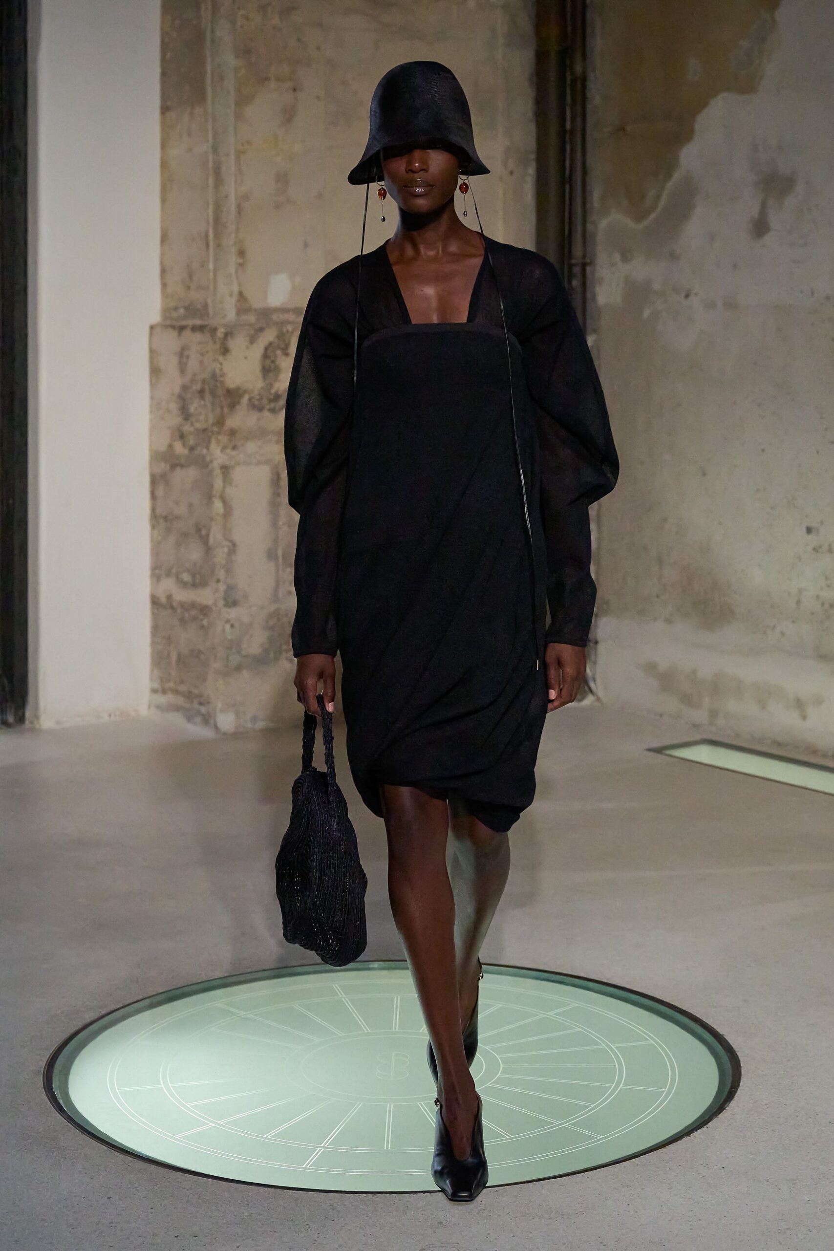 black fitted midi dress with accessories