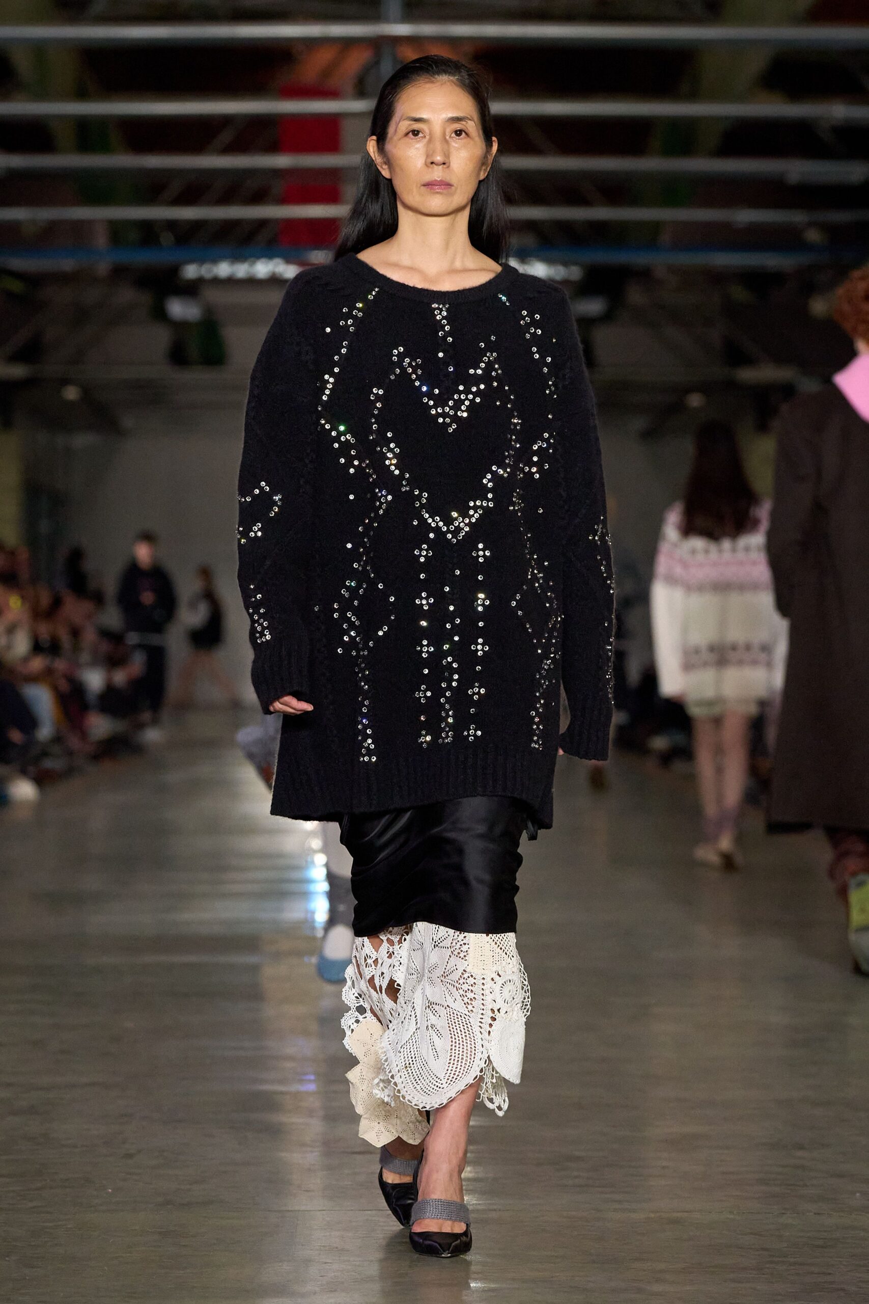 oversized black sweater with layered skirt