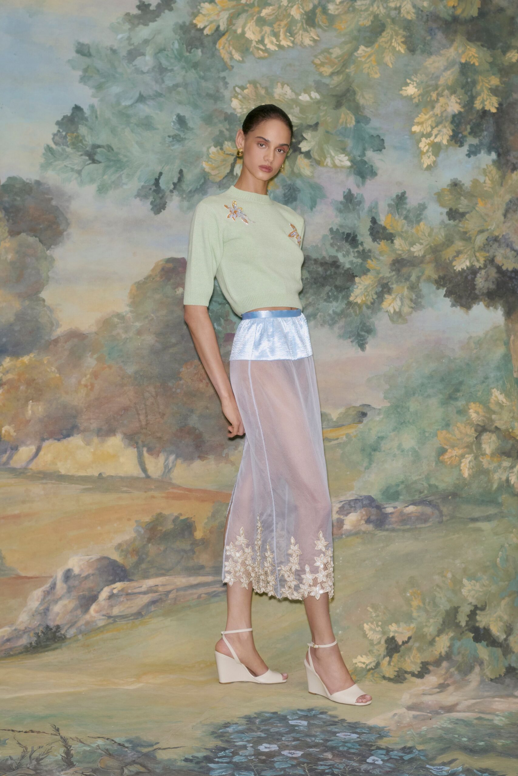 green embroidered top with blue skirt