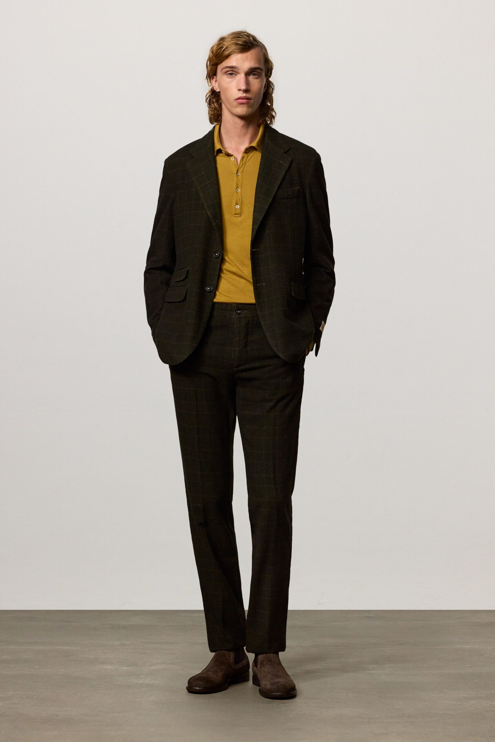 black tailored suit with yellow shirt