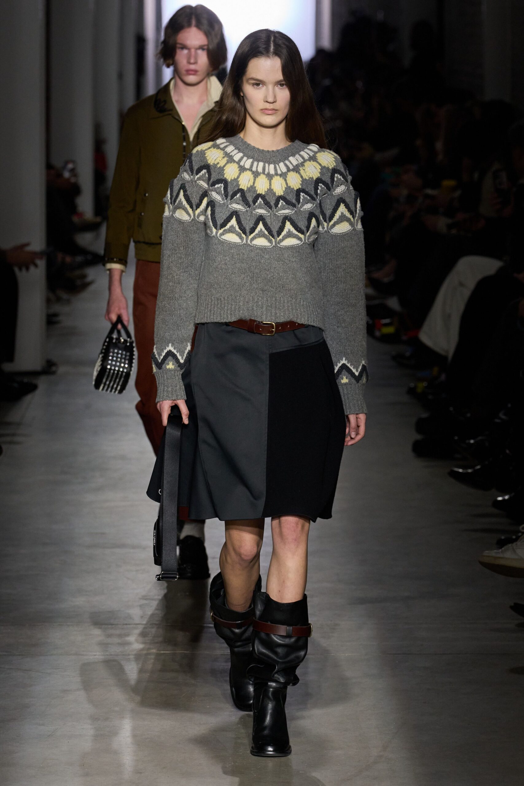gray patterned sweater with black skirt
