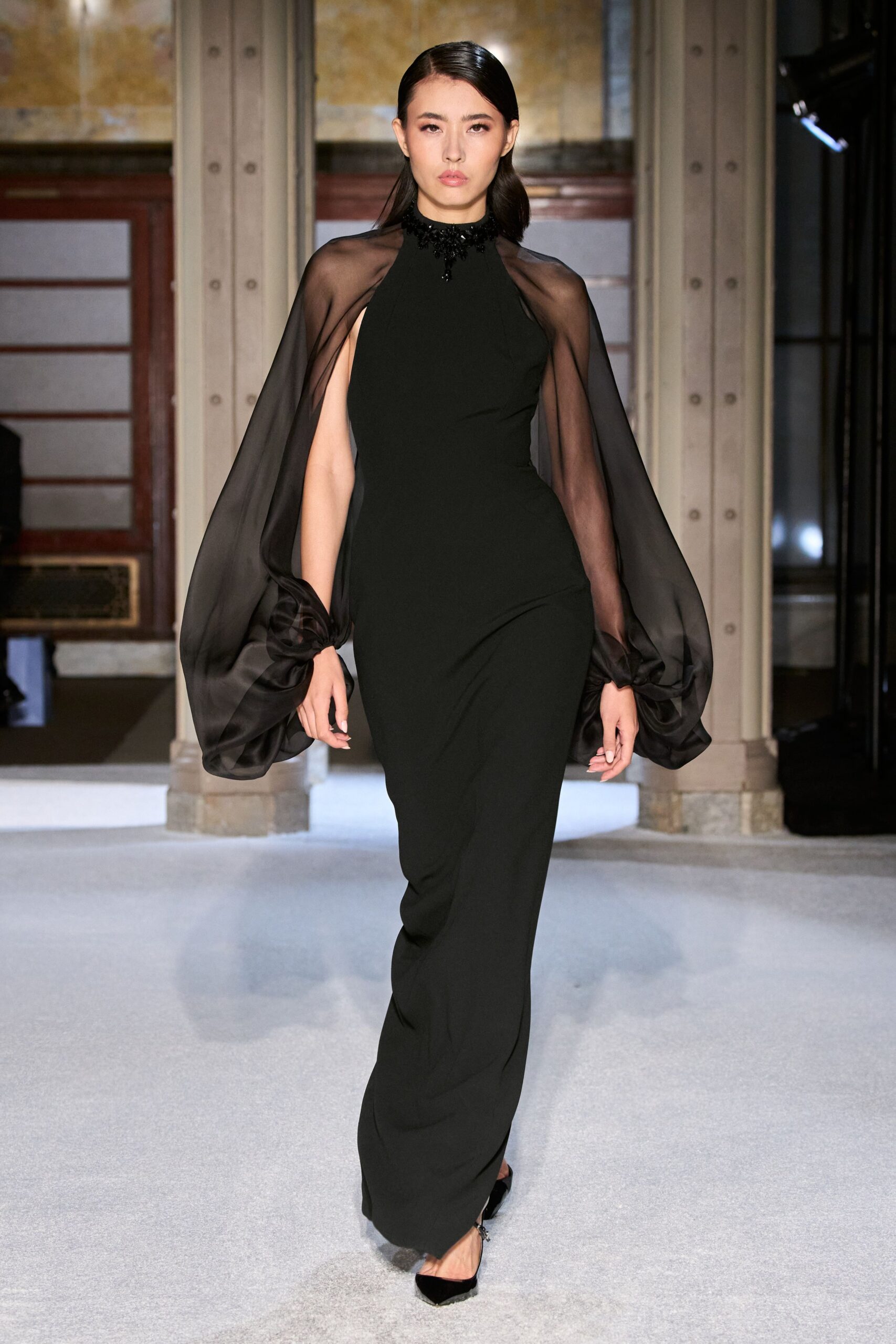 black silk sleeveless high-neck fitted draped flowing gown