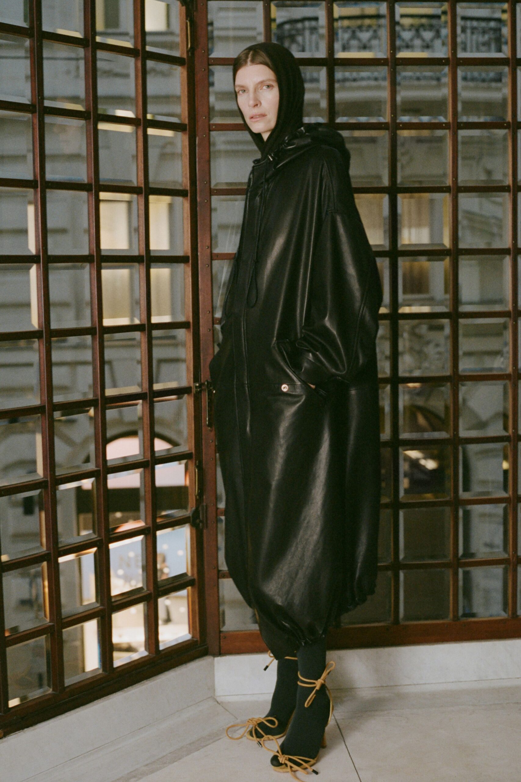black oversized leather coat and shoes