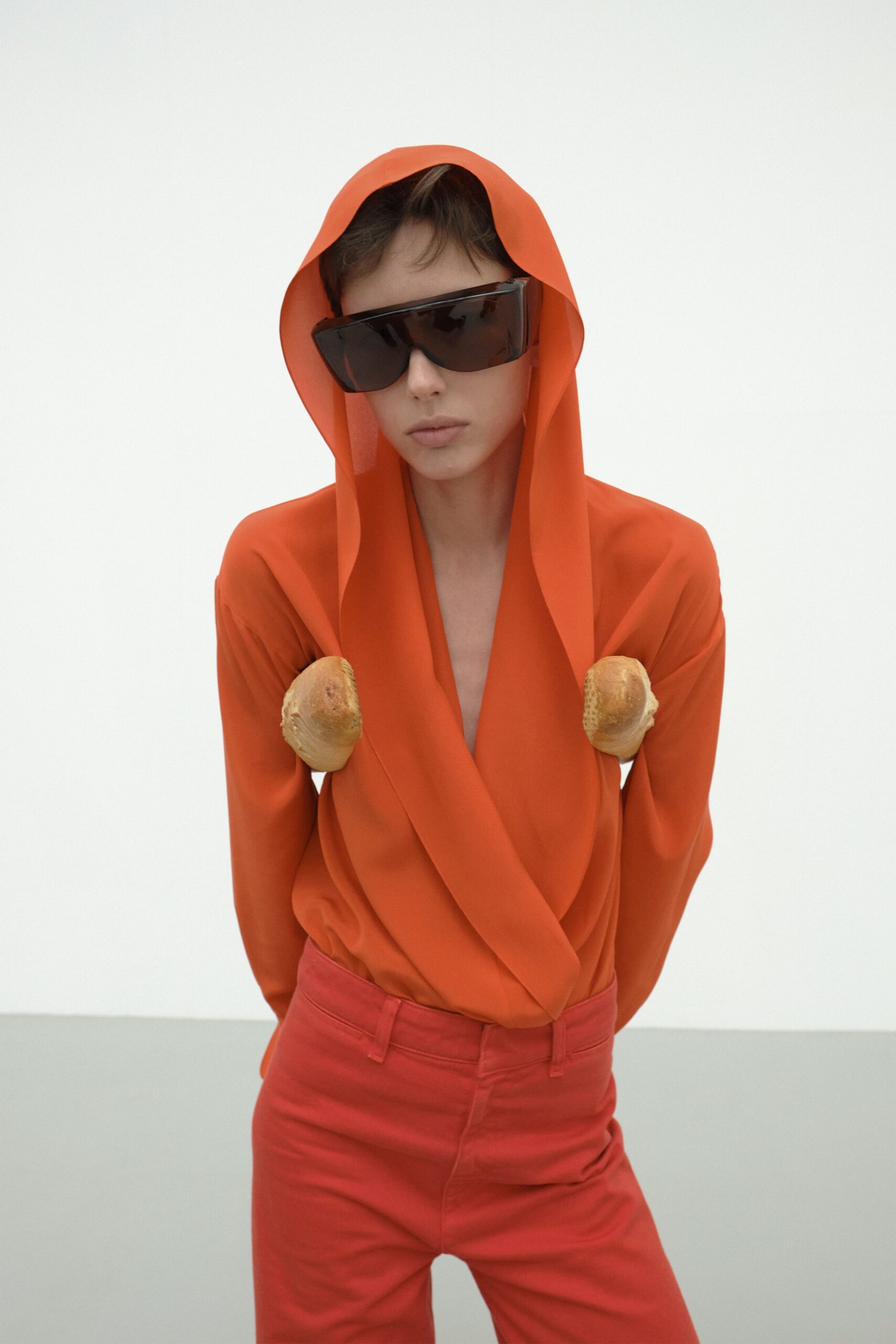 orange long-sleeve v-neck fitted draped top