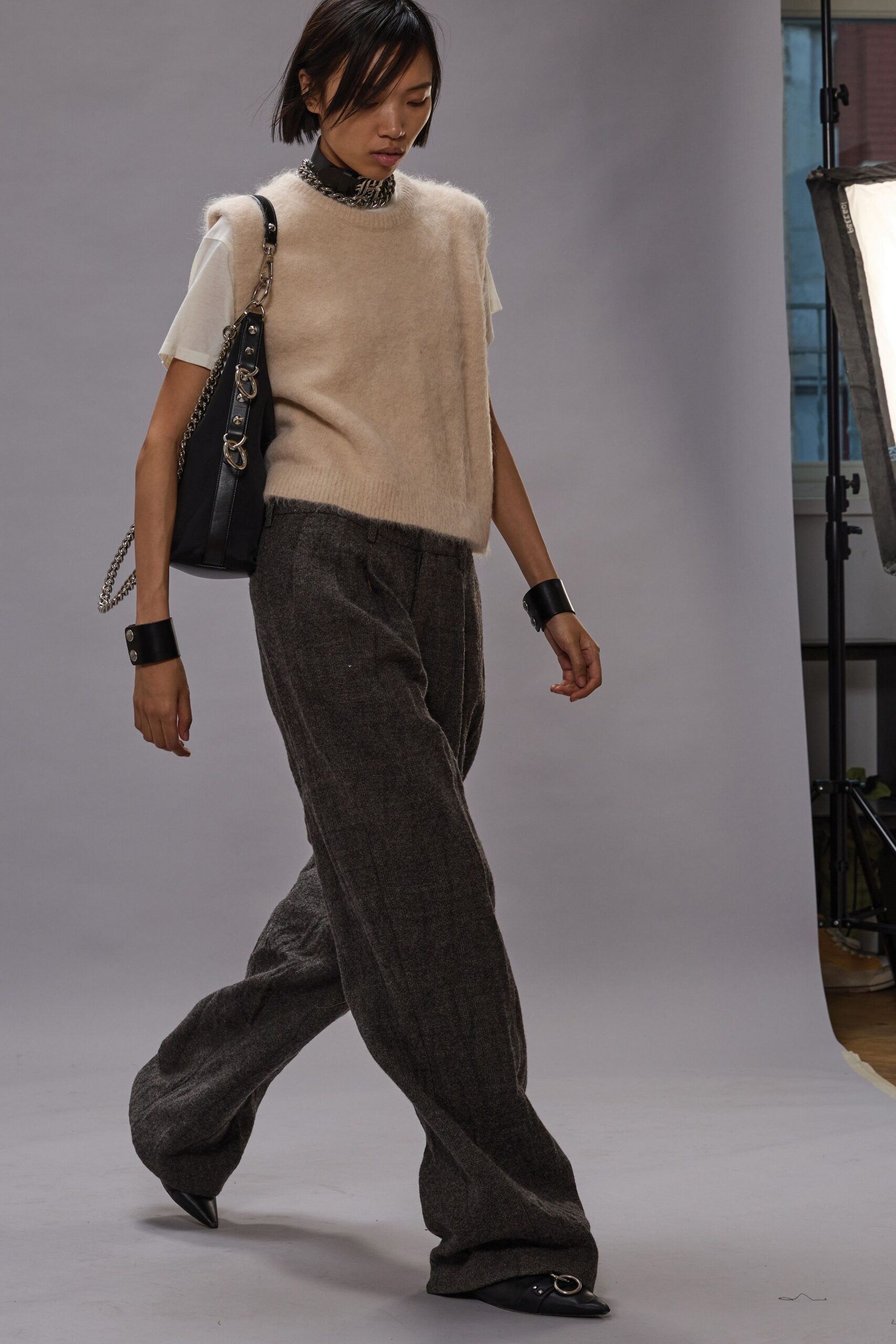 beige sweater white shirt gray pants
