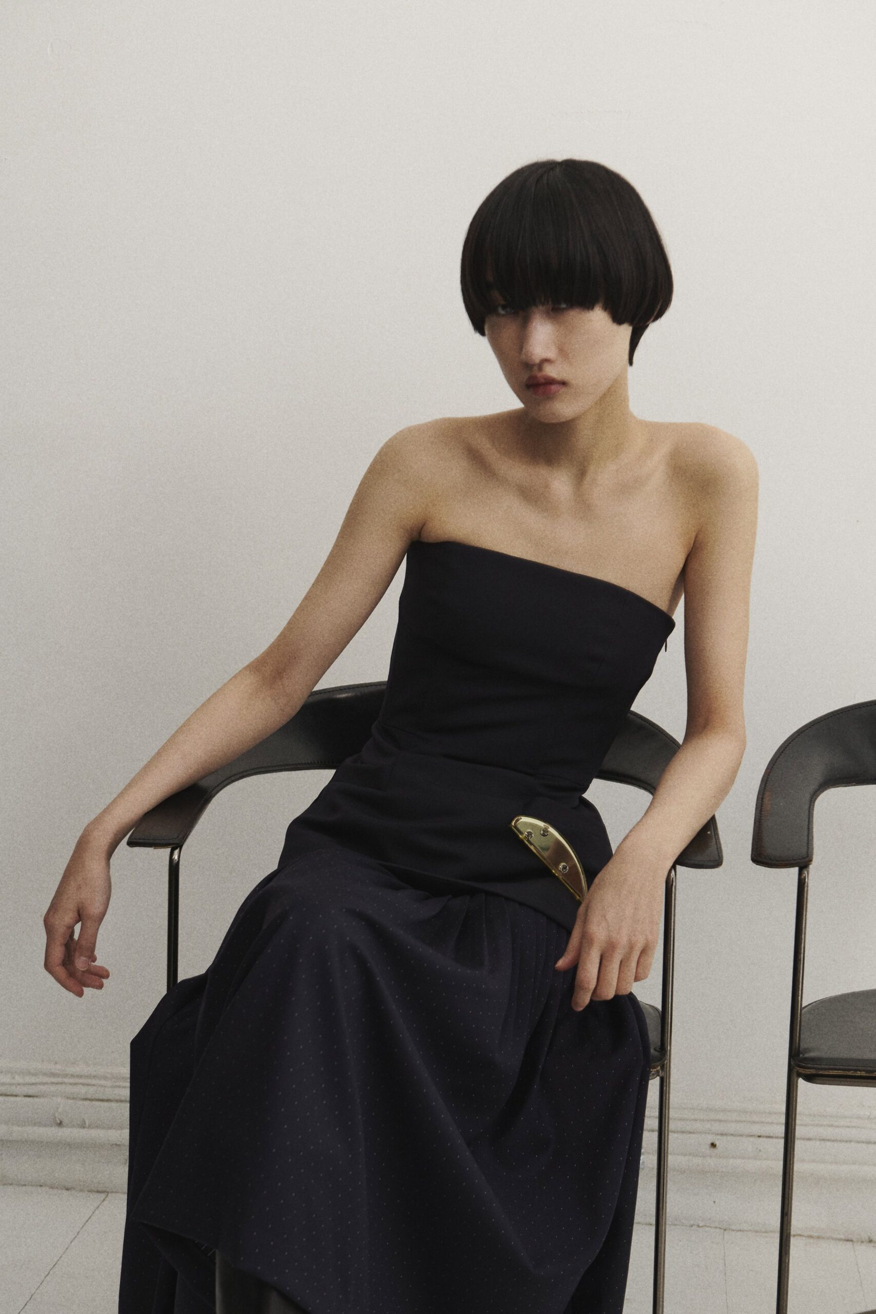 black strapless draped gown