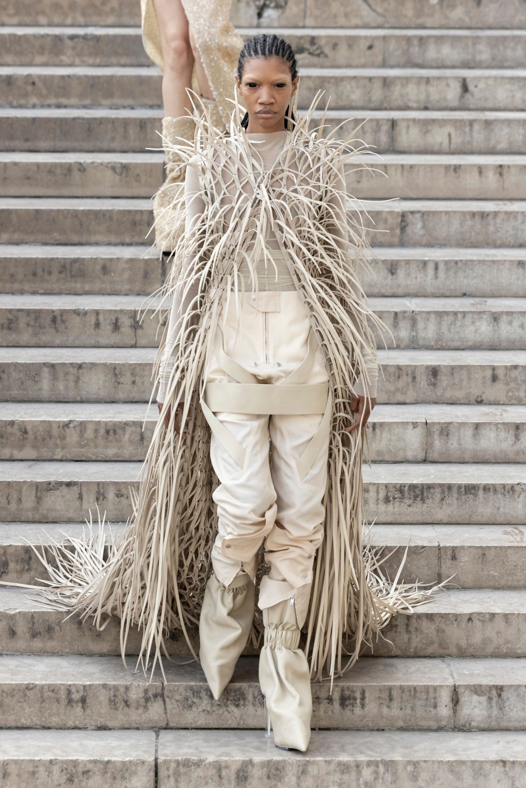 beige layered fringed dress with relaxed pants