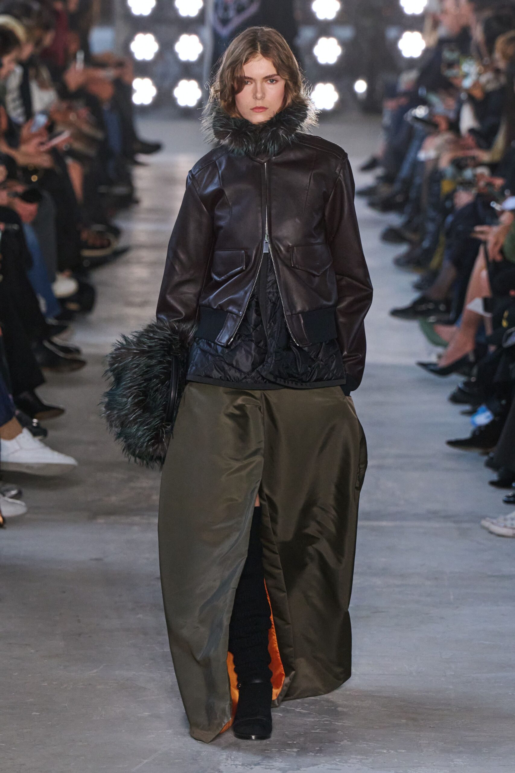 black leather jacket with green skirt