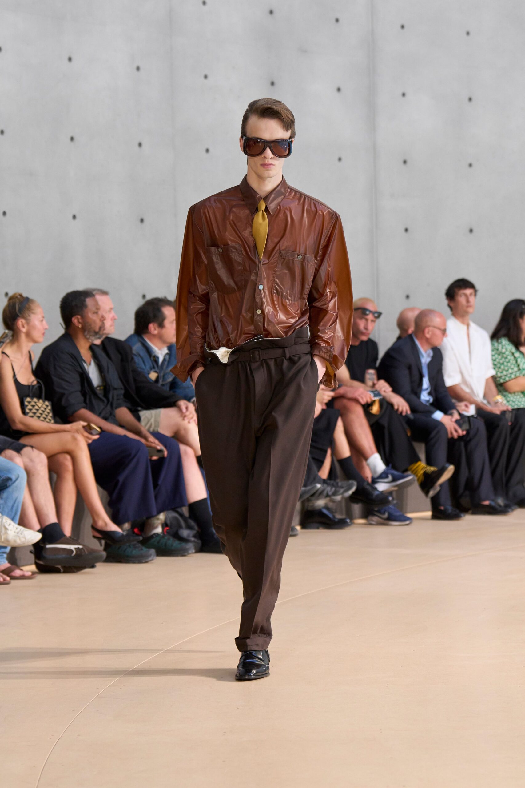 brown leather shirt with black pants
