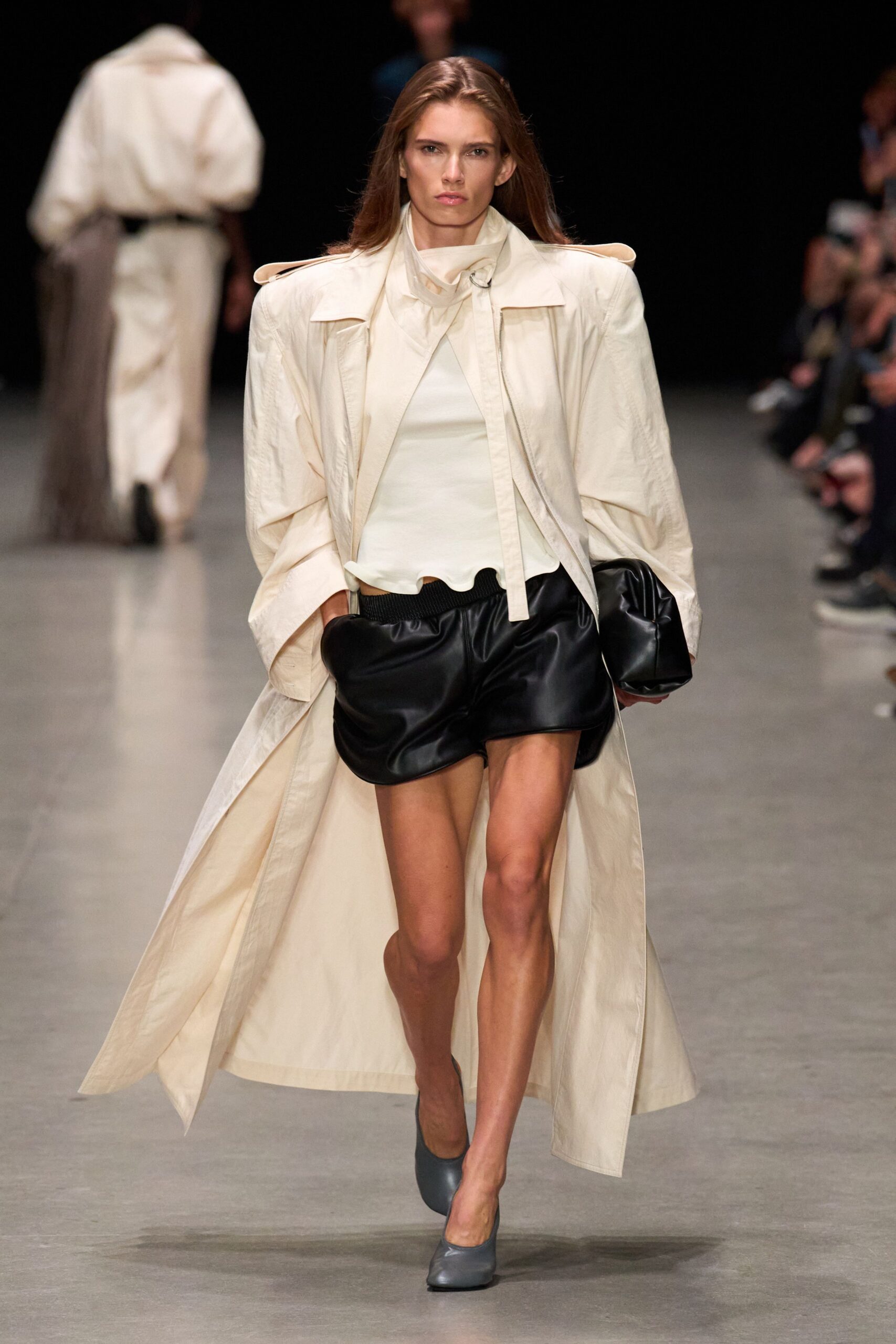 white coat black leather shorts