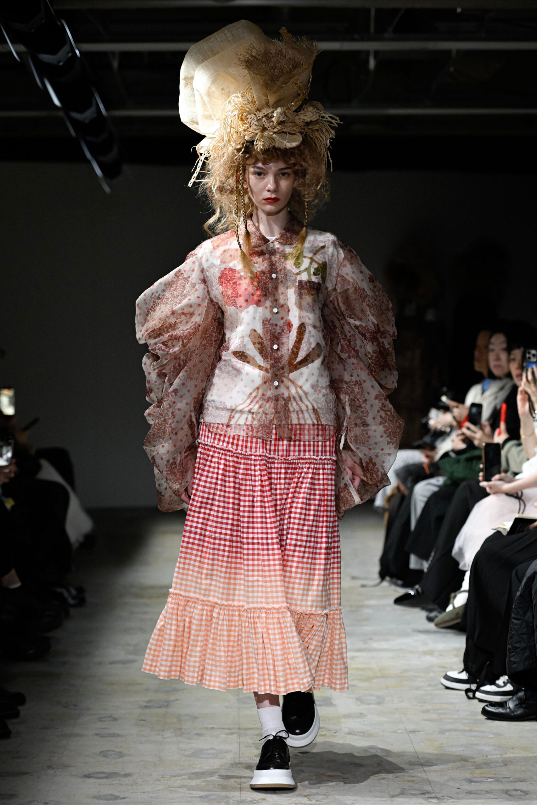 pink embroidered shirt and red checked skirt