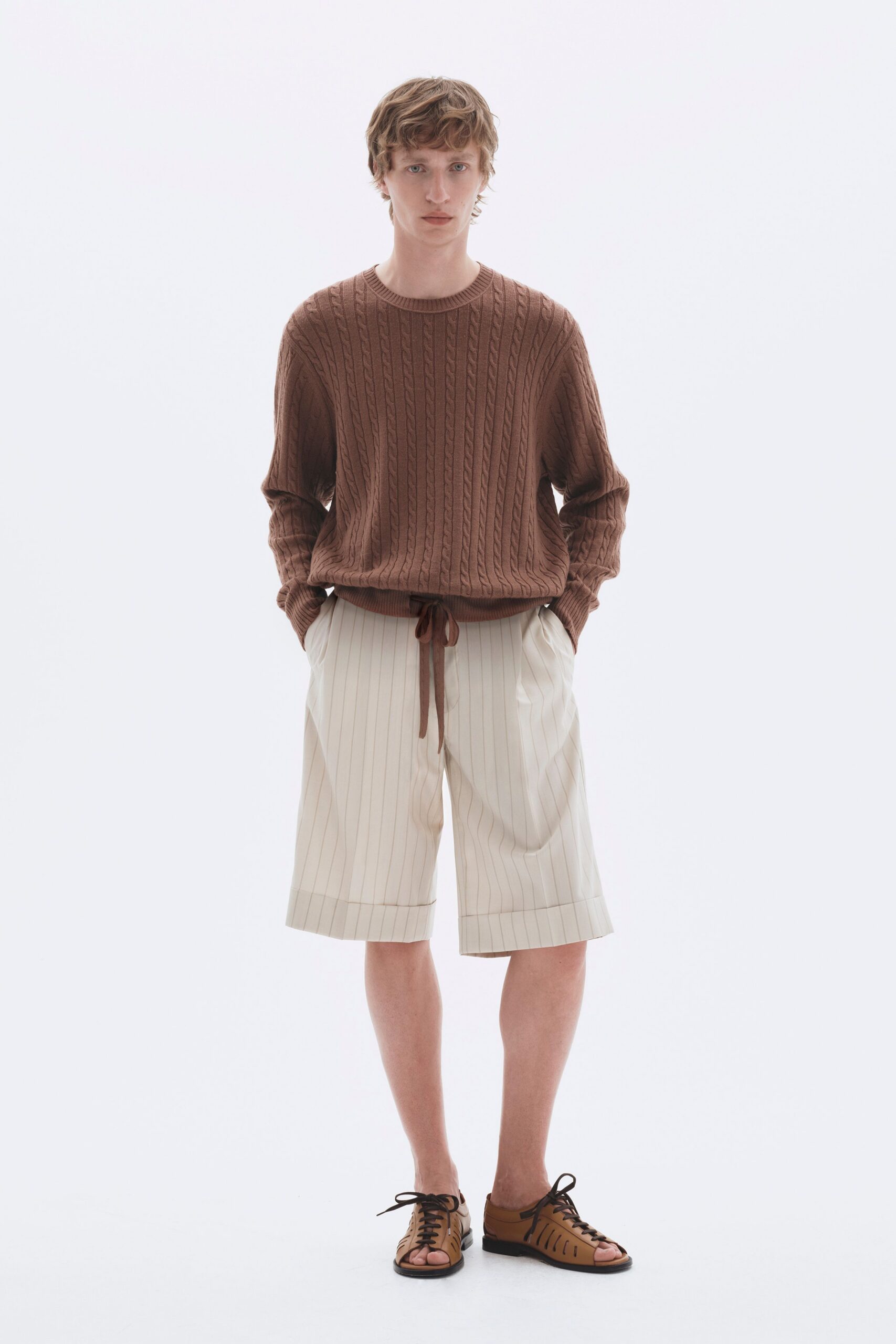 brown relaxed sweater with beige shorts