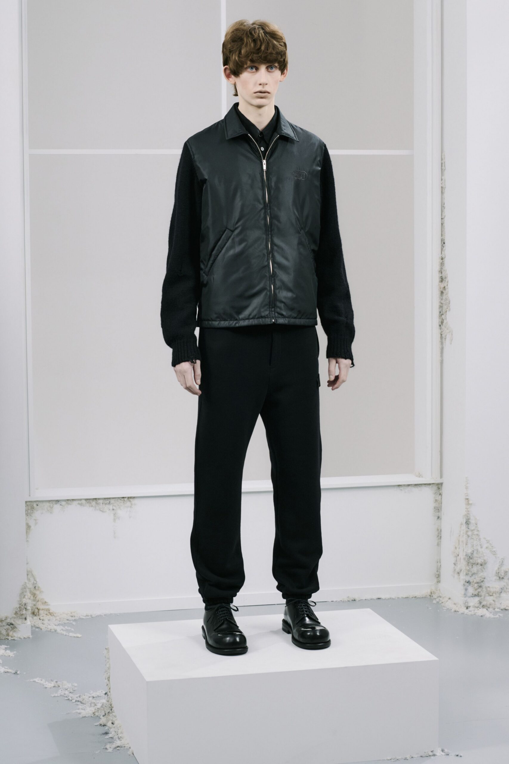black nylon jacket with relaxed pants
