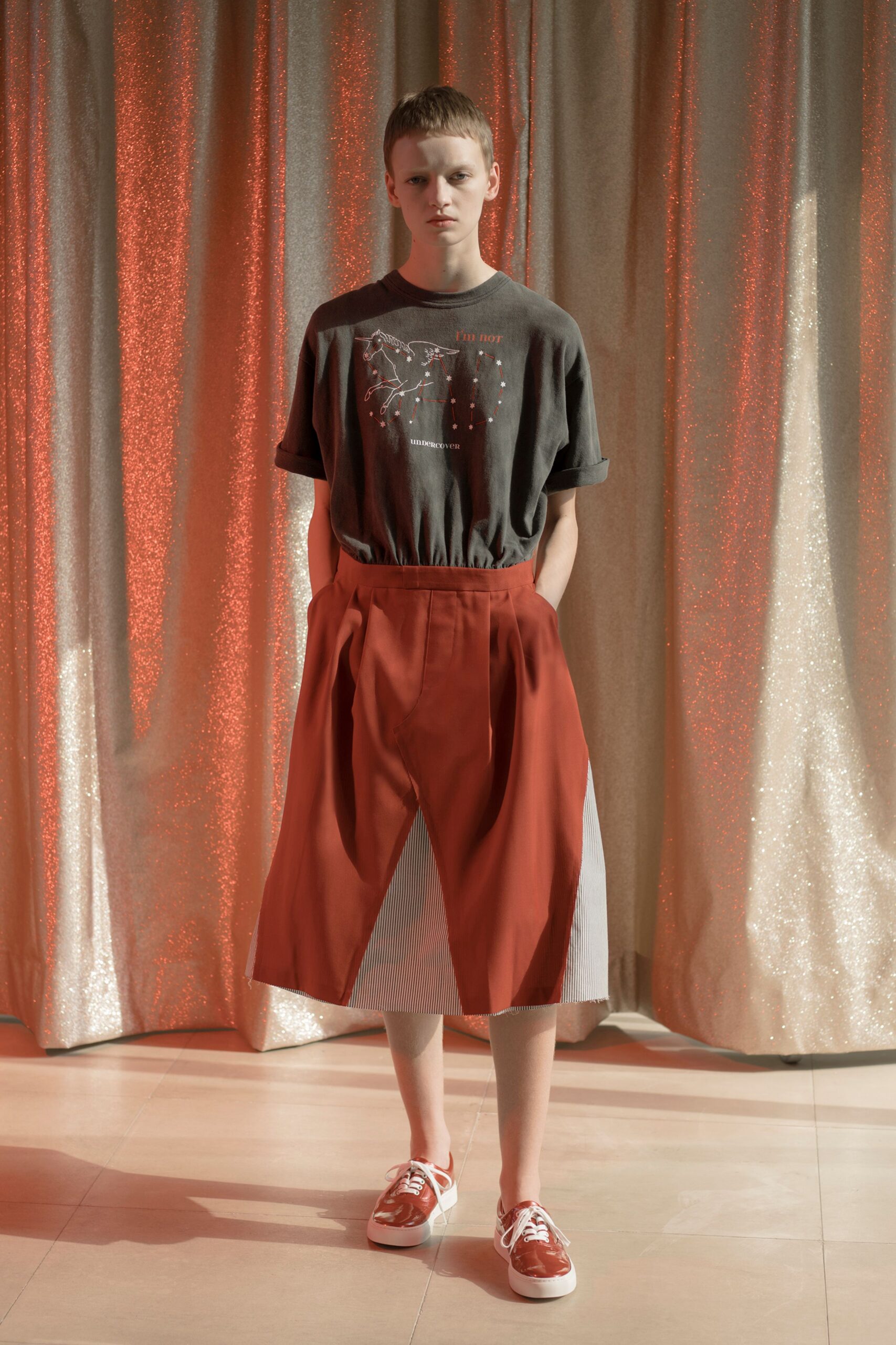 gray t-shirt red pleated skirt