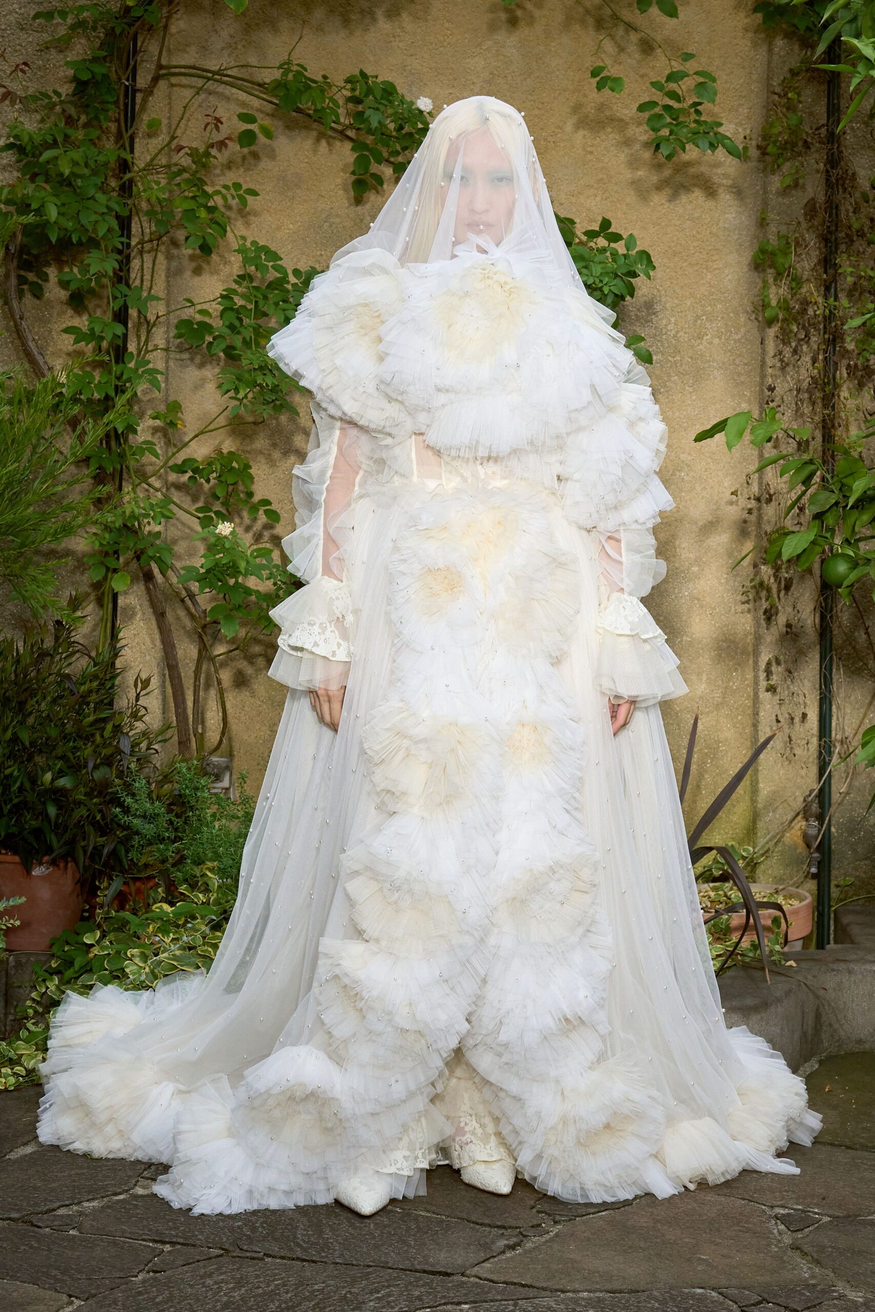 white tulle long-sleeve fitted ruffled layered flowing gown