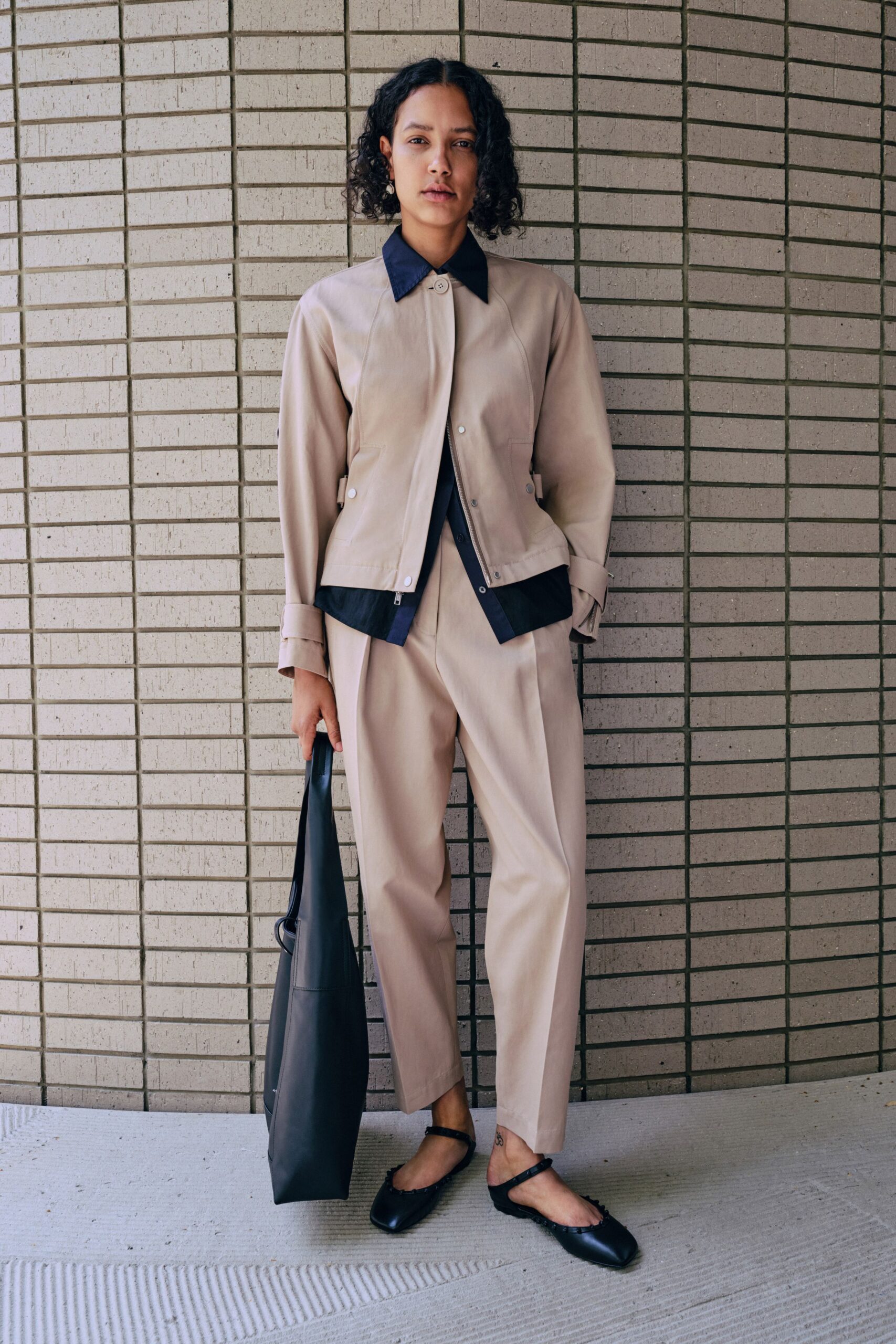 beige relaxed jacket with navy shirt
