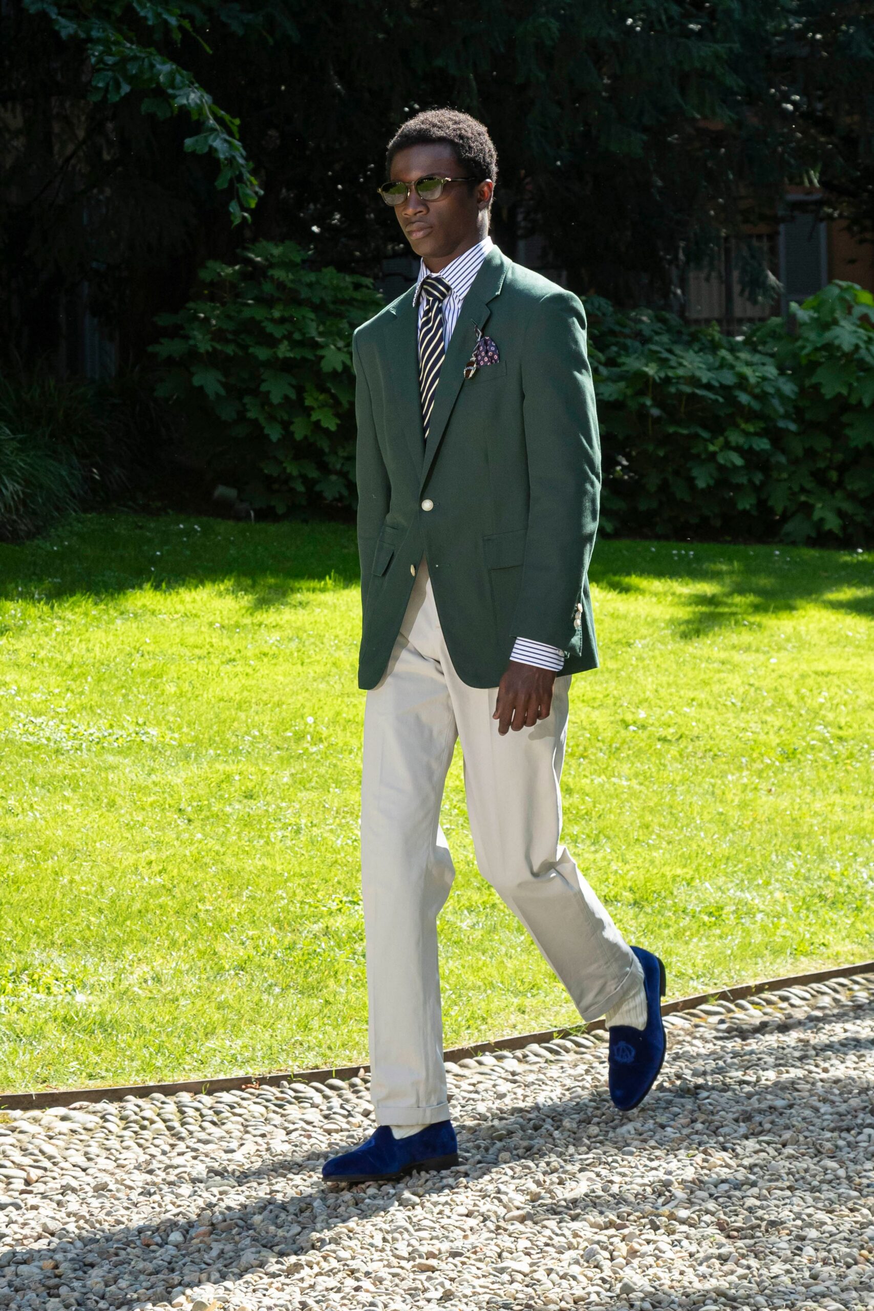 green tailored blazer with beige pants