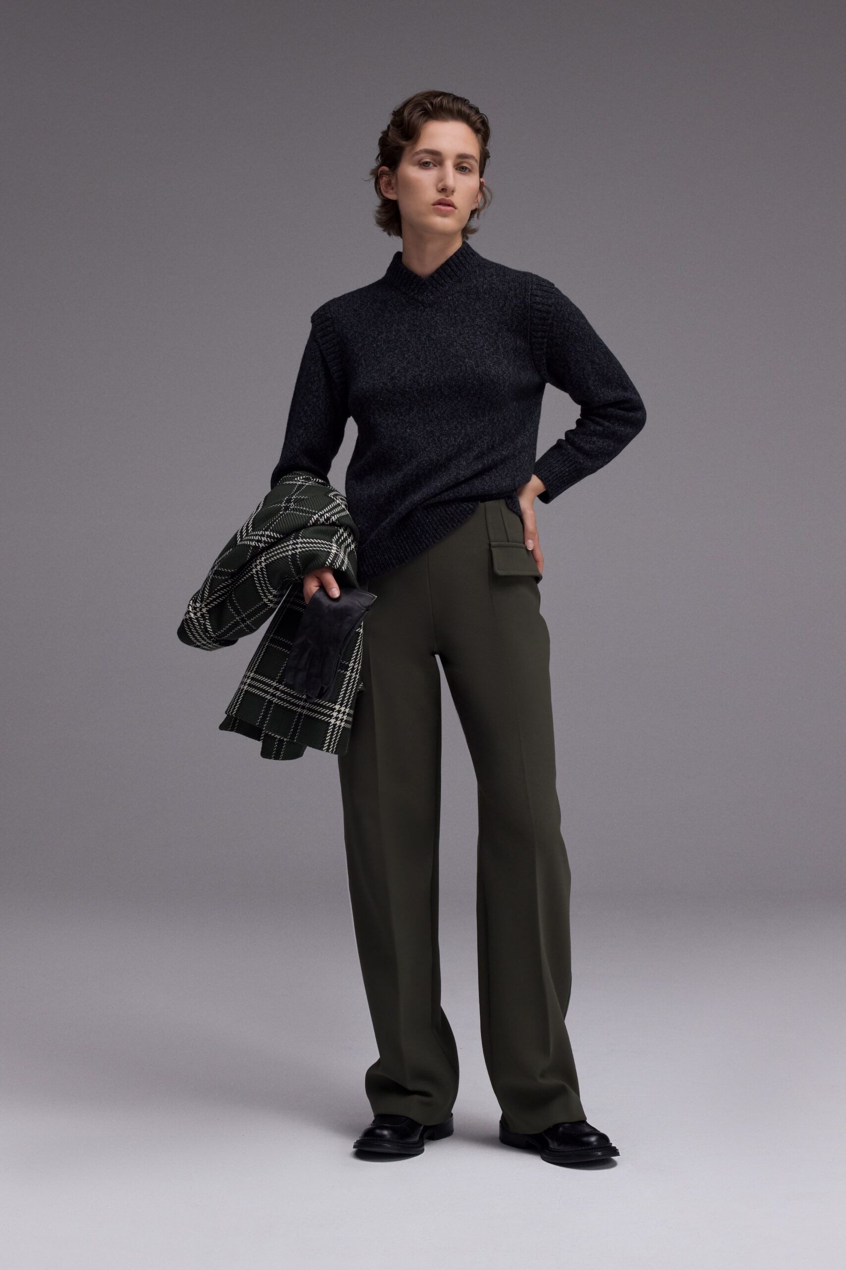 black sweater green pants coat