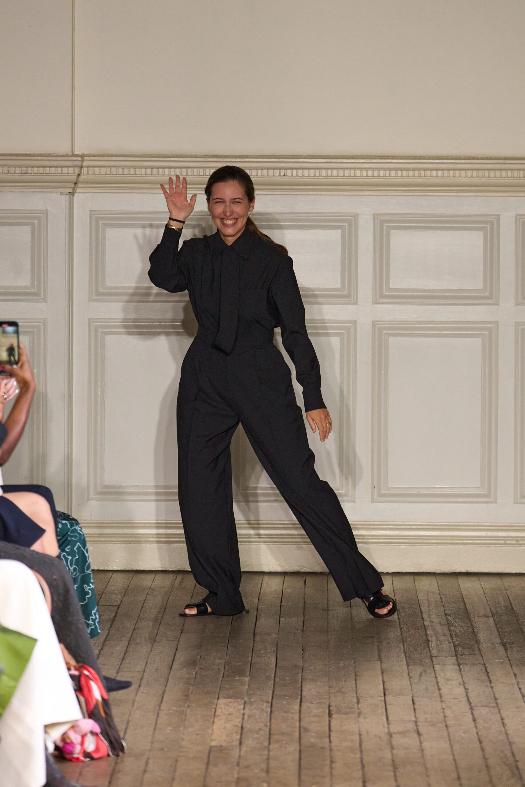 black relaxed jumpsuit with flat shoes