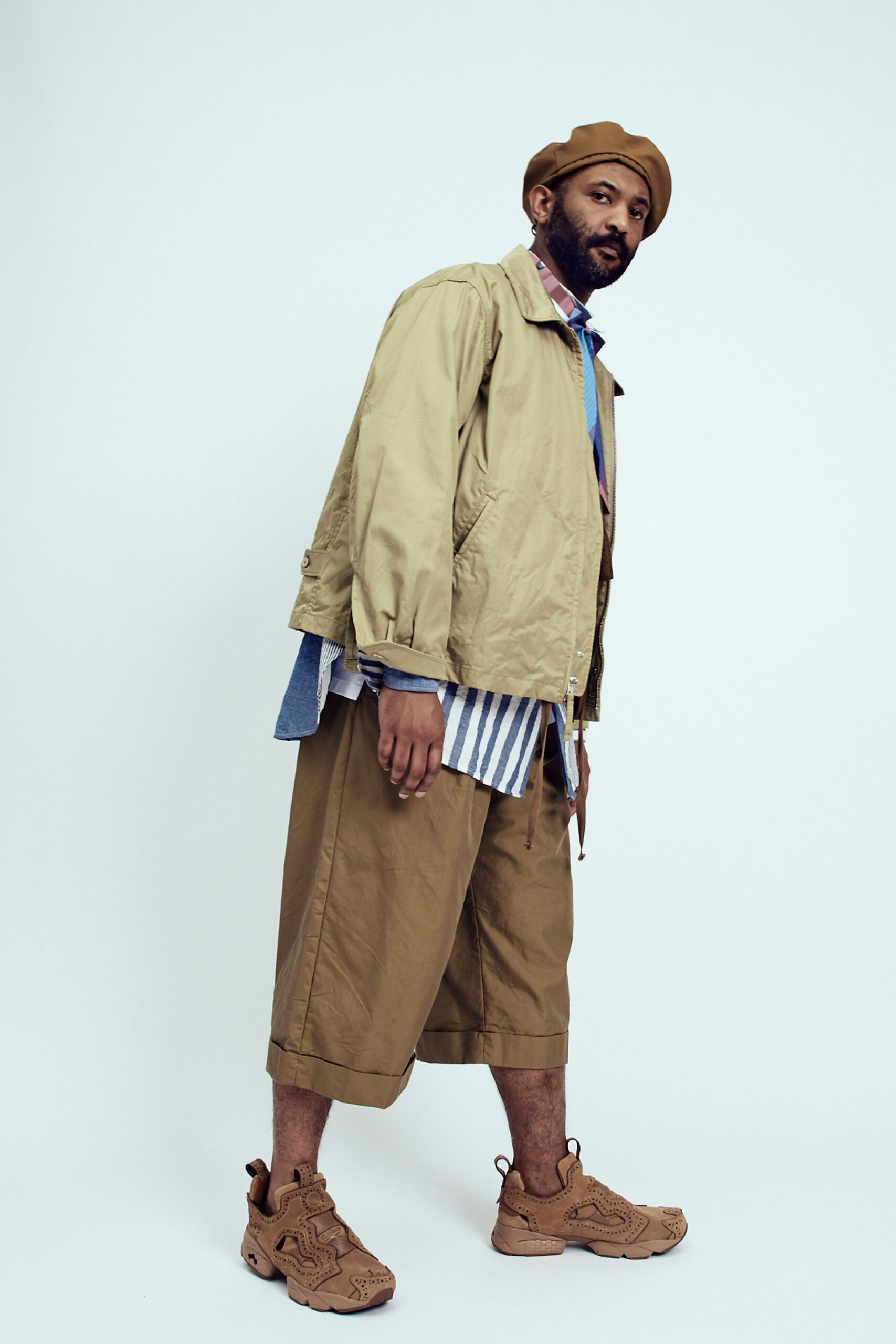 beige jacket with striped shirt